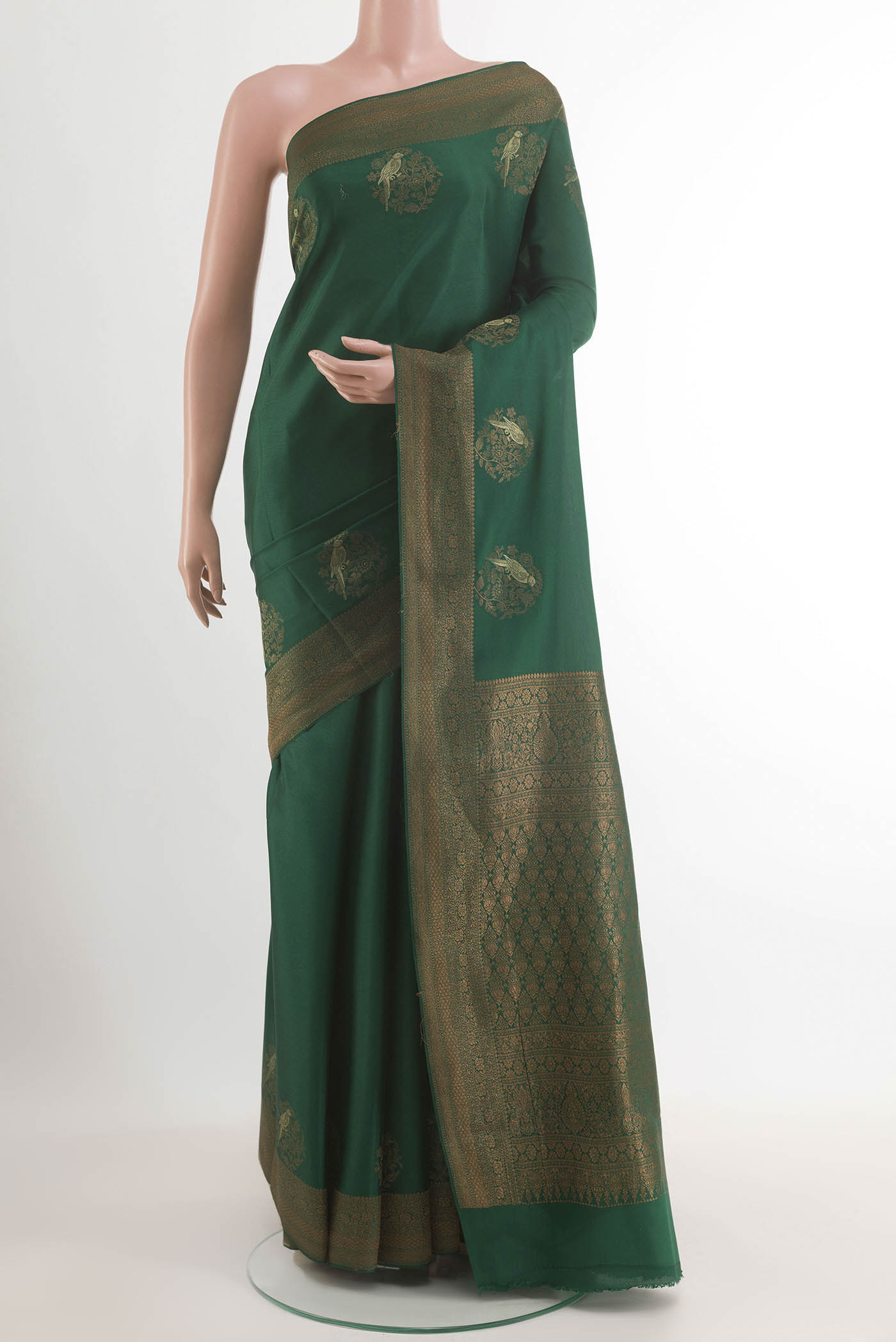 Green Mysore Crepe Saree with Zari Butta on the body and Zari Border.  displayed on a mannequin