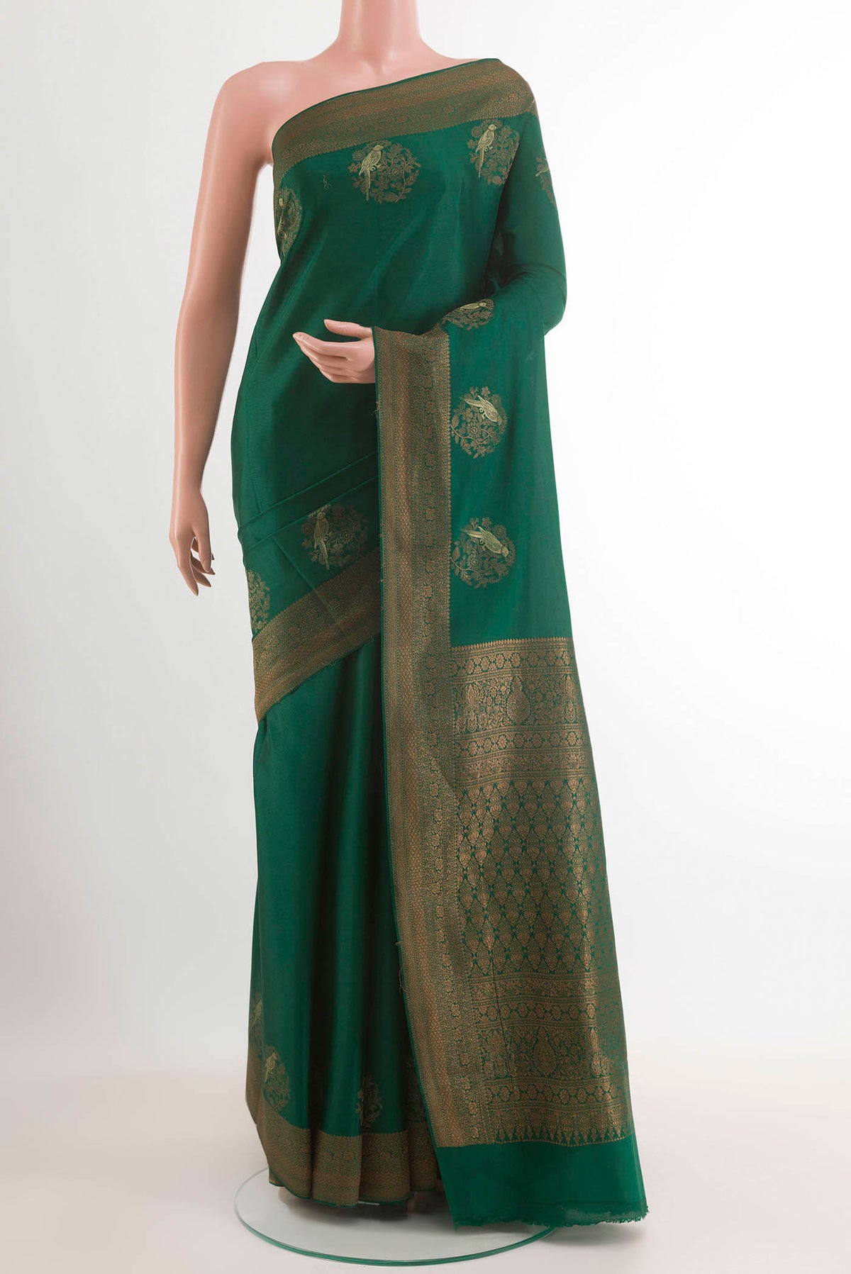 Green Mysore Crepe Saree with Zari Butta on the body and Zari Border.  displayed on a mannequin