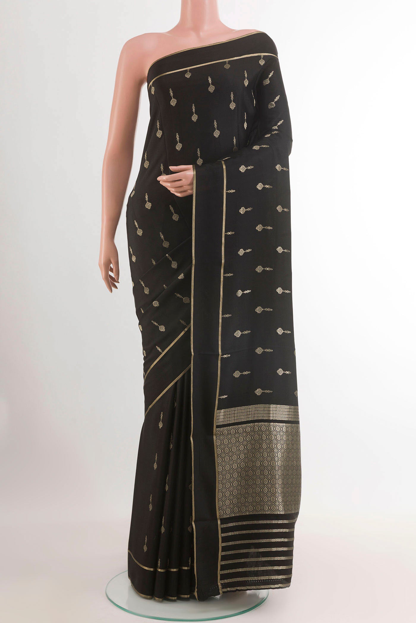 Black Mysore Crepe Saree with Plain Body and Zari Border.  displayed on a mannequin