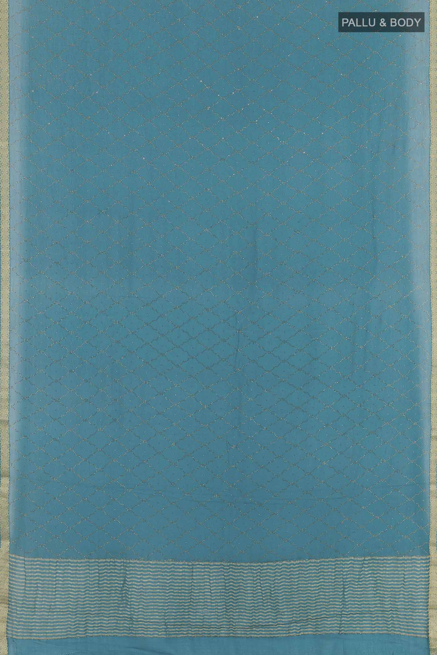 Flat view of Blue Mysore Chiffon Saree with Embroidery on the body and Zari Border. 