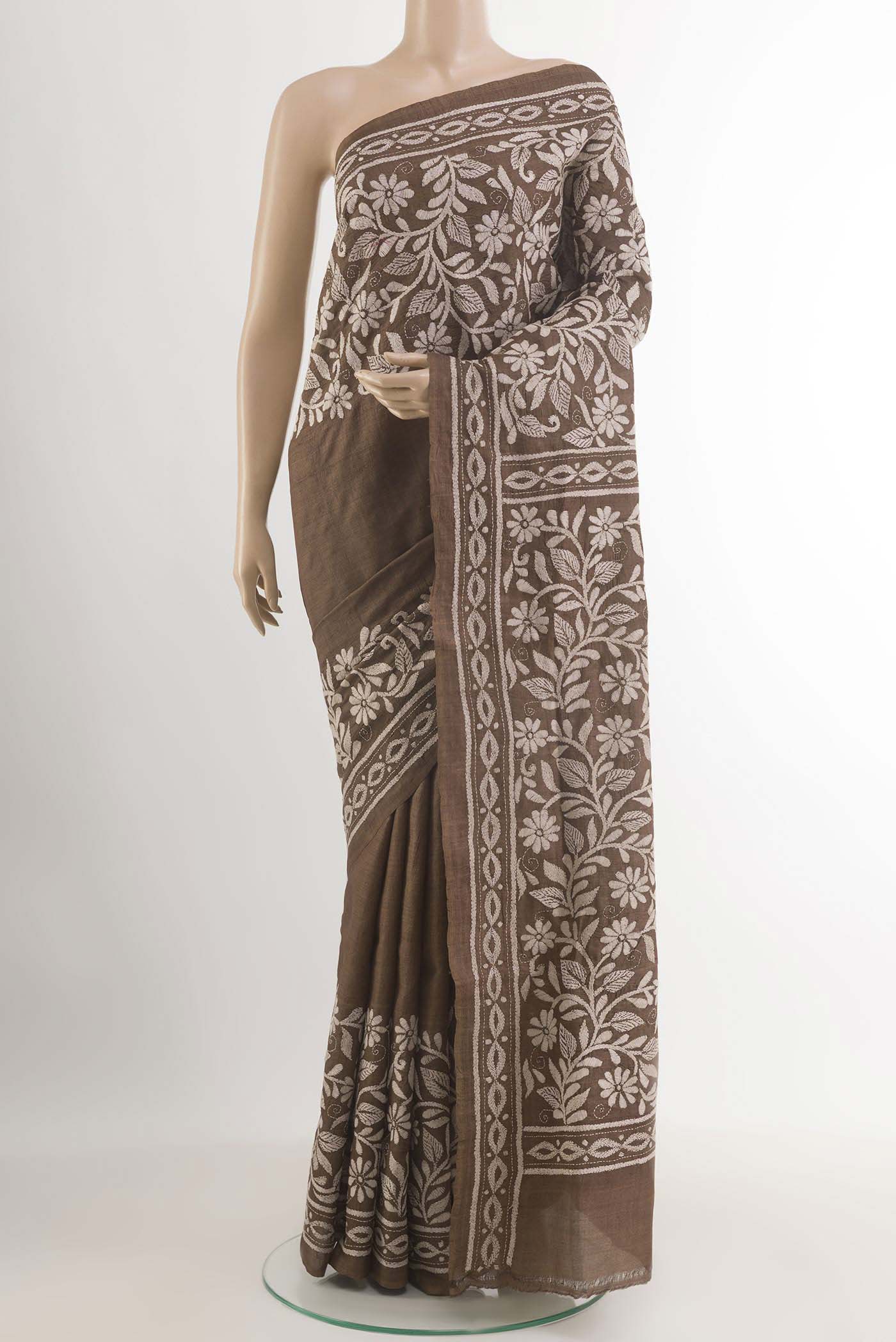Brown Tussar Saree with Kantha Work on the body and Embroidery Border.  displayed on a mannequin