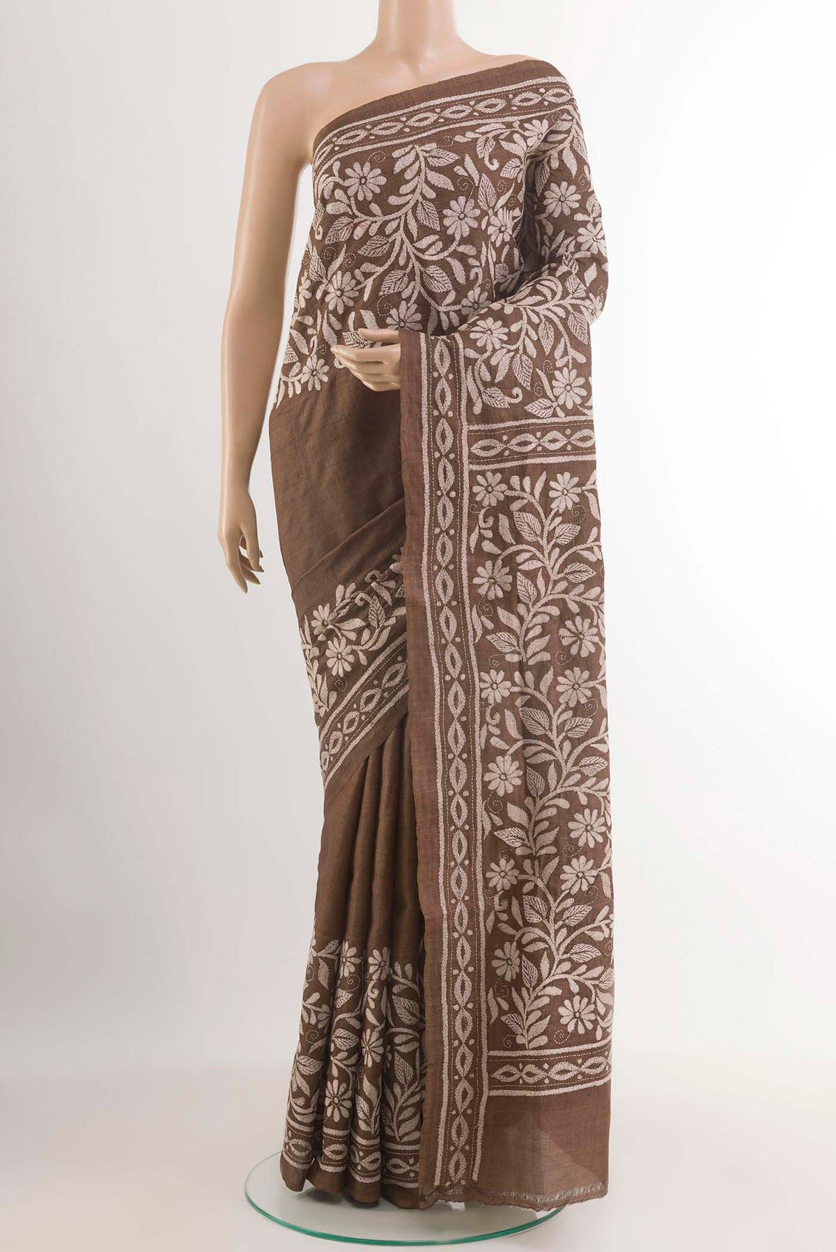 Brown Tussar Saree with Kantha Work on the body and Embroidery Border.  displayed on a mannequin