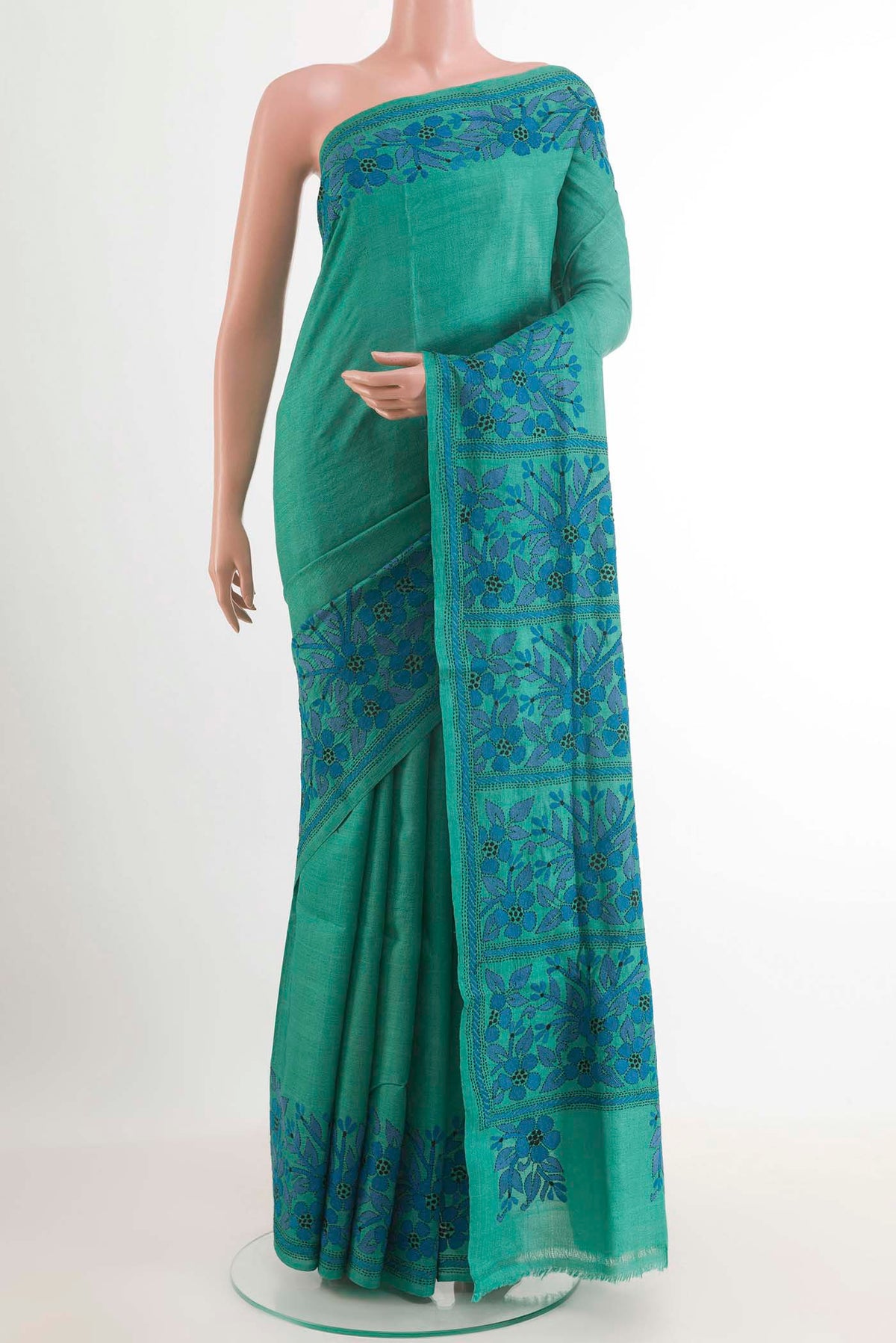 Blue Tussar Saree with Kantha Work on the body and Embroidery Border.  displayed on a mannequin