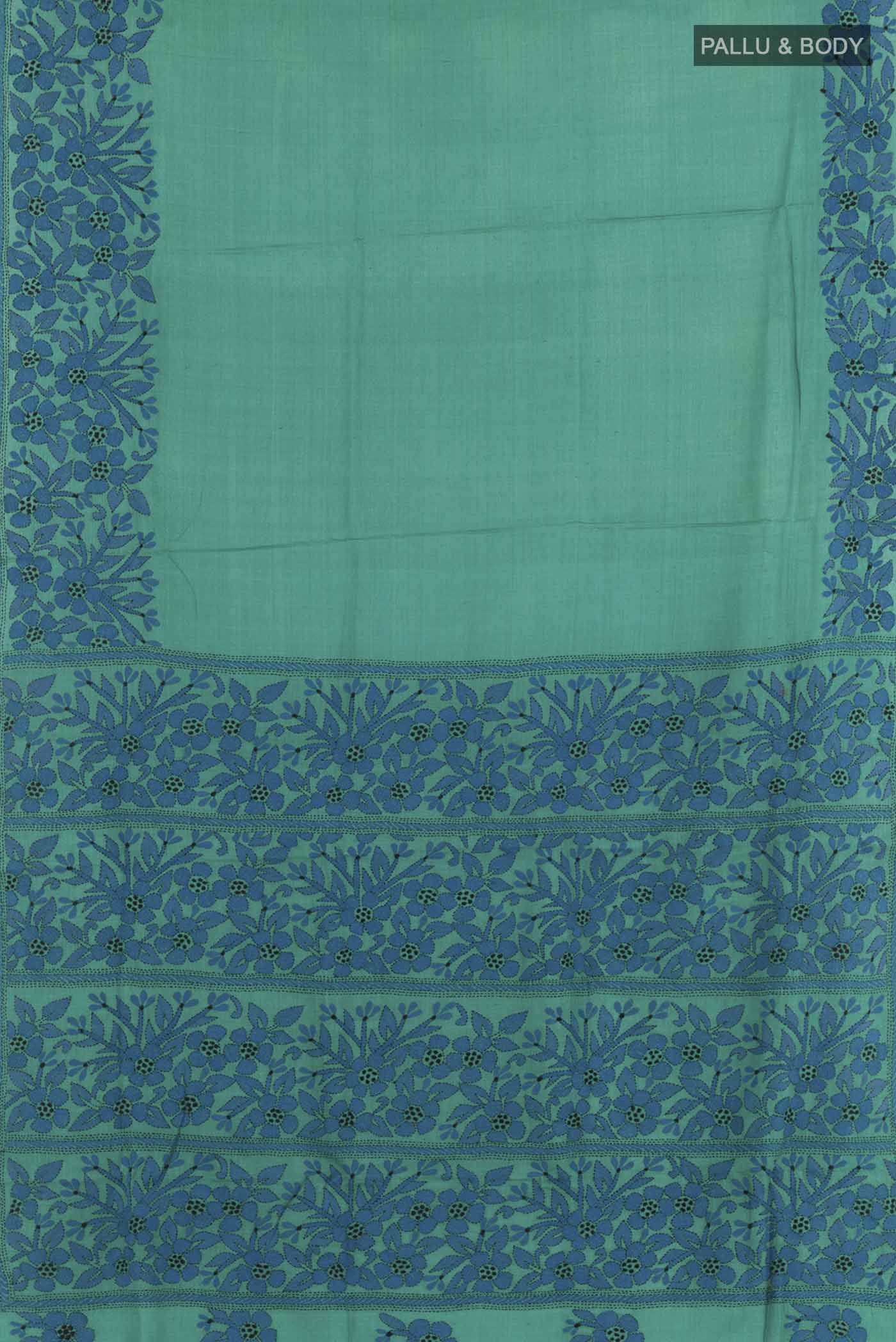 Flat view of Blue Tussar Saree with Kantha Work on the body and Embroidery Border. 