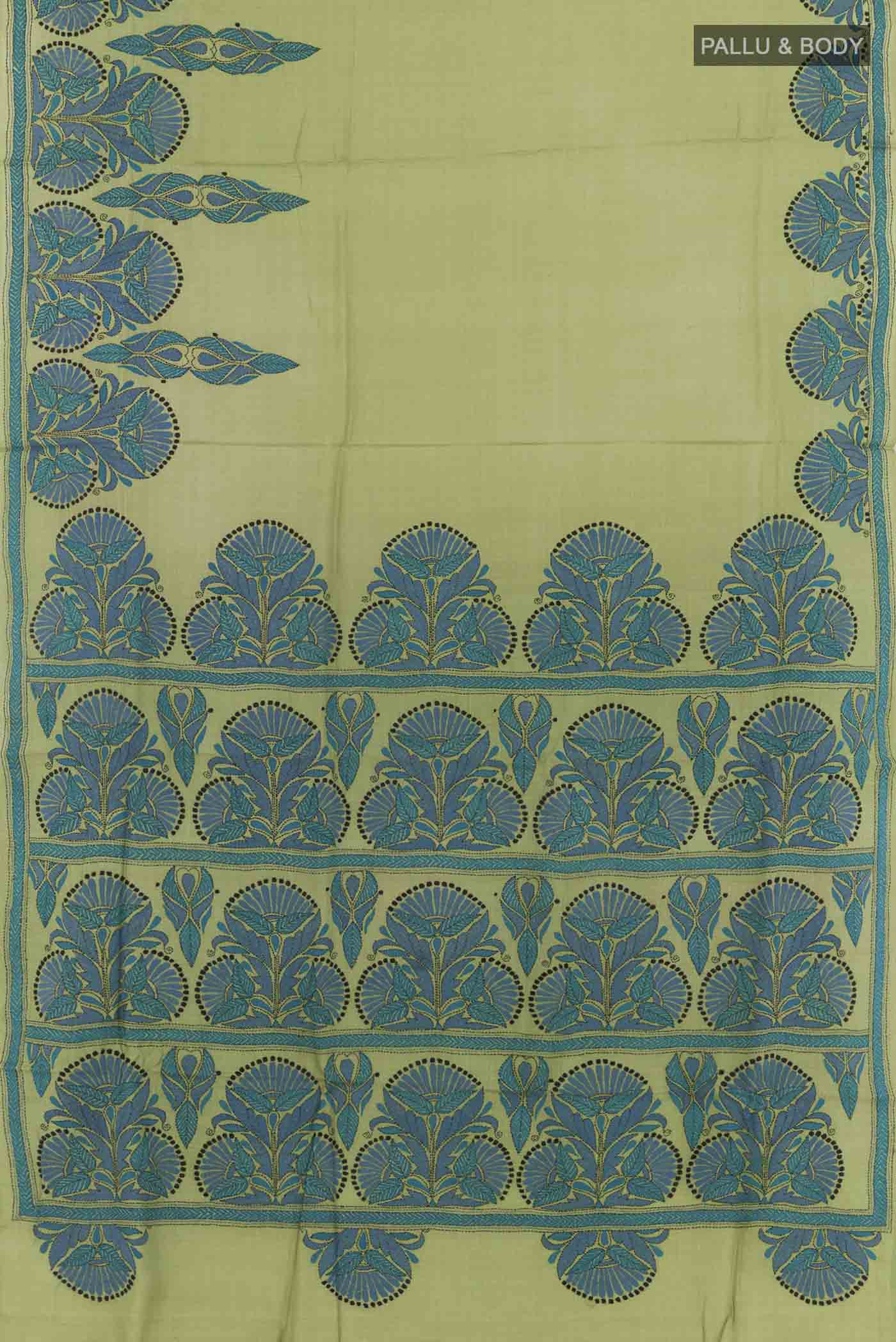 Flat view of Green Tussar Saree with Kantha Work on the body and Embroidery Border. 