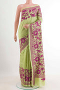 Light Green Tussar Saree with Kantha Work on the body and Embroidery Border.  displayed on a mannequin