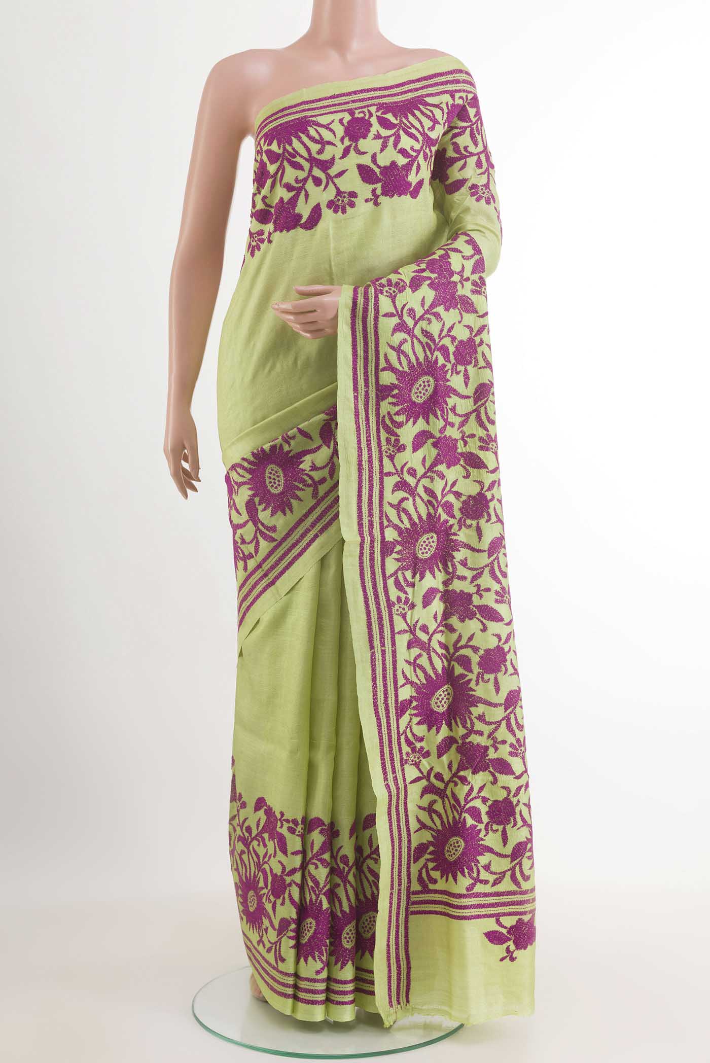 Light Green Tussar Saree with Kantha Work on the body and Embroidery Border.  displayed on a mannequin