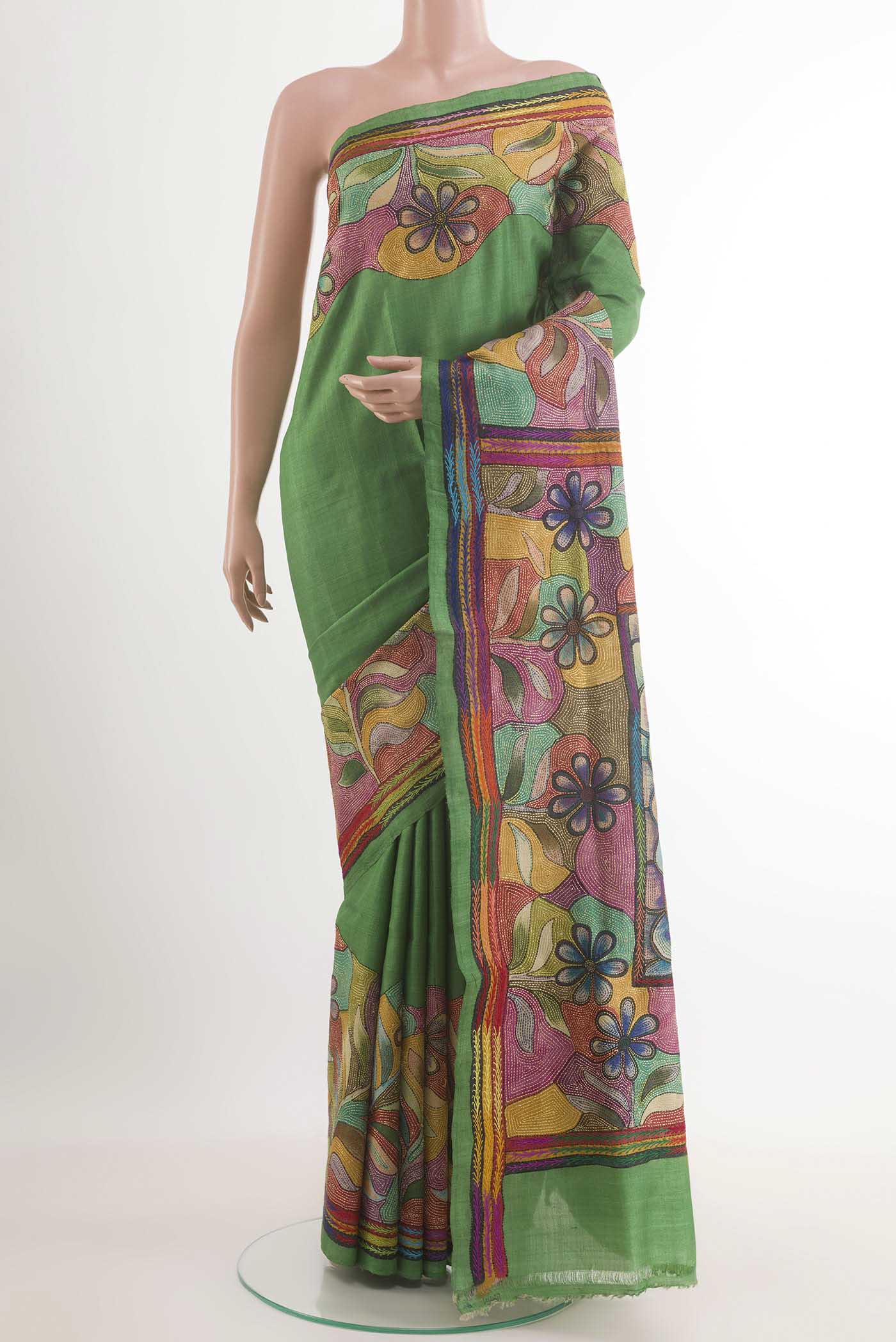 Green Tussar Saree with Kantha Work on the body and Embroidery Border.  displayed on a mannequin