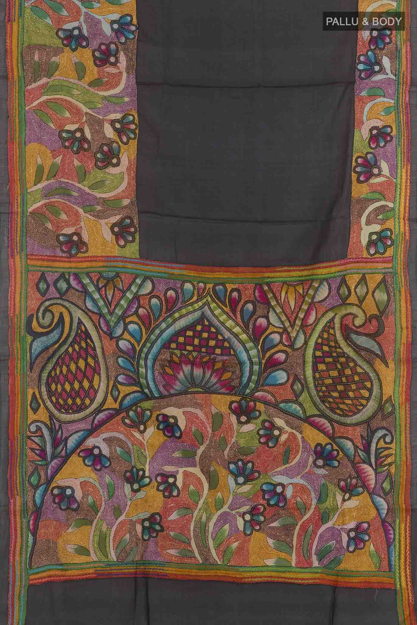 Flat view of Black Tussar Saree with Kantha Work on the body and Embroidery Border. 