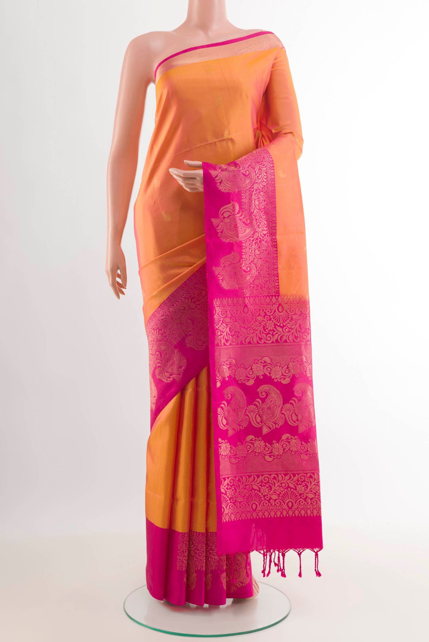 Mustard Soft Silk Saree with Zari Brocade on the body and Zari Border.  displayed on a mannequin