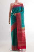 Blue Soft Silk Saree with Zari Butta on the body and Zari Border.  displayed on a mannequin