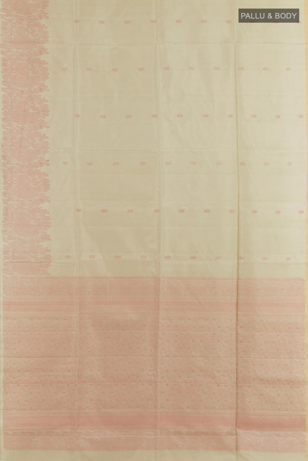 Flat view of Cream Soft Silk Saree with Thread Butta on the body and Zari Border. 
