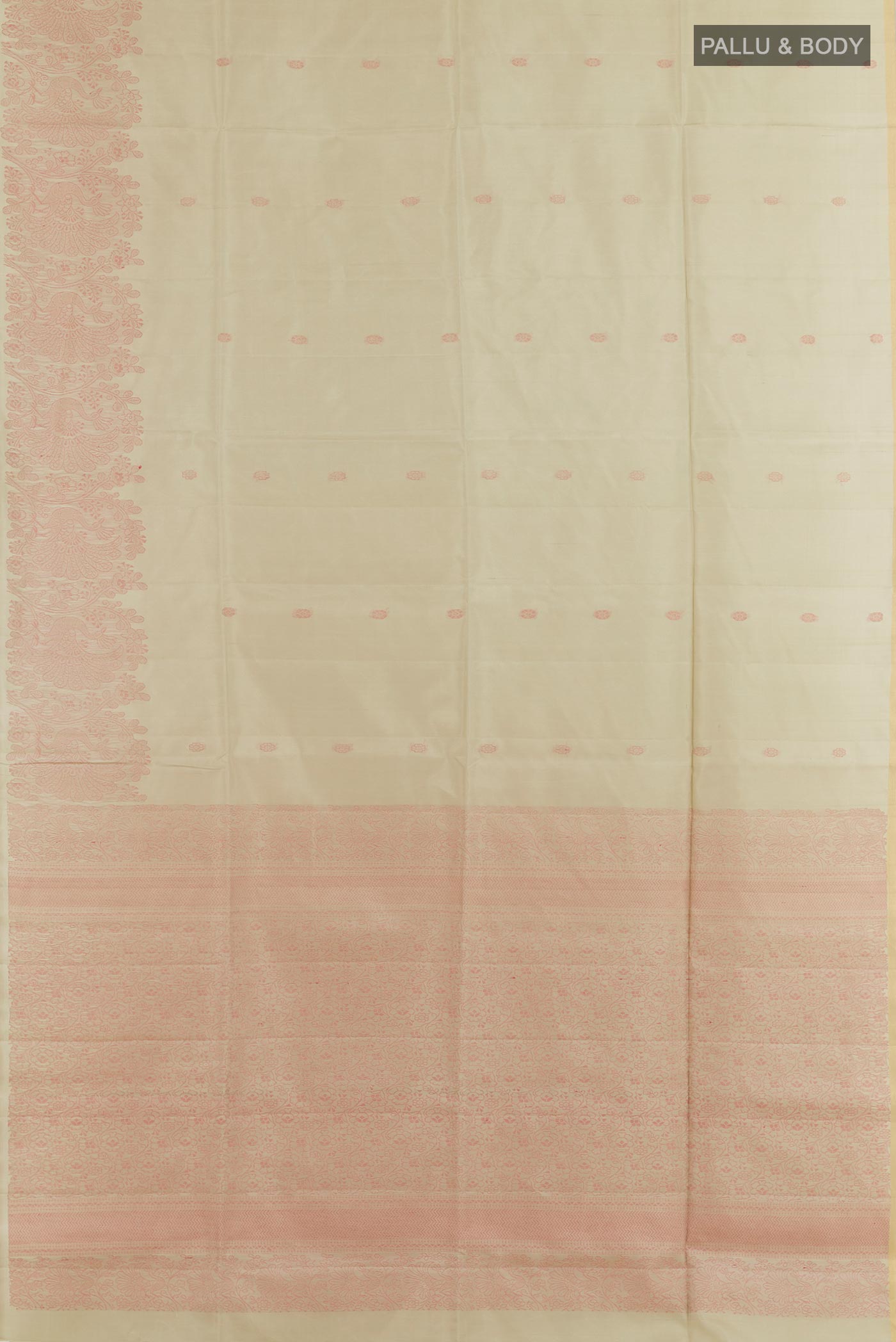 Flat view of Cream Soft Silk Saree with Thread Butta on the body and Zari Border. 