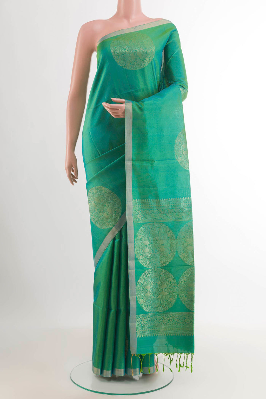 Sea Green Soft Silk Saree with Zari Butta on the body and Zari Border.  displayed on a mannequin