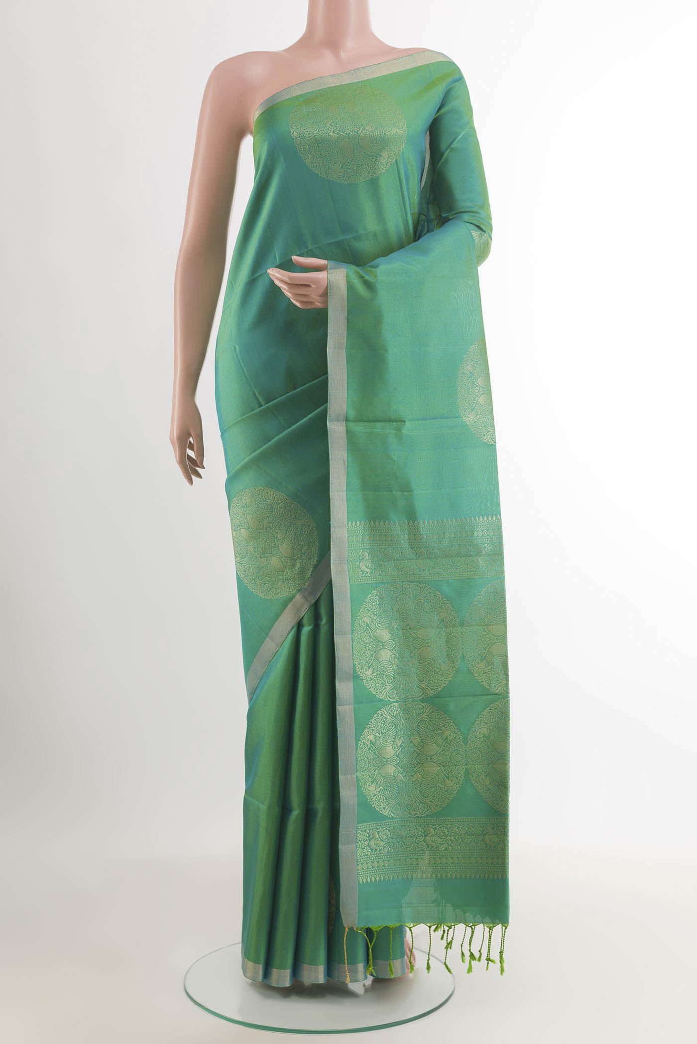 Sea Green Soft Silk Saree with Zari Butta on the body and Zari Border.  displayed on a mannequin