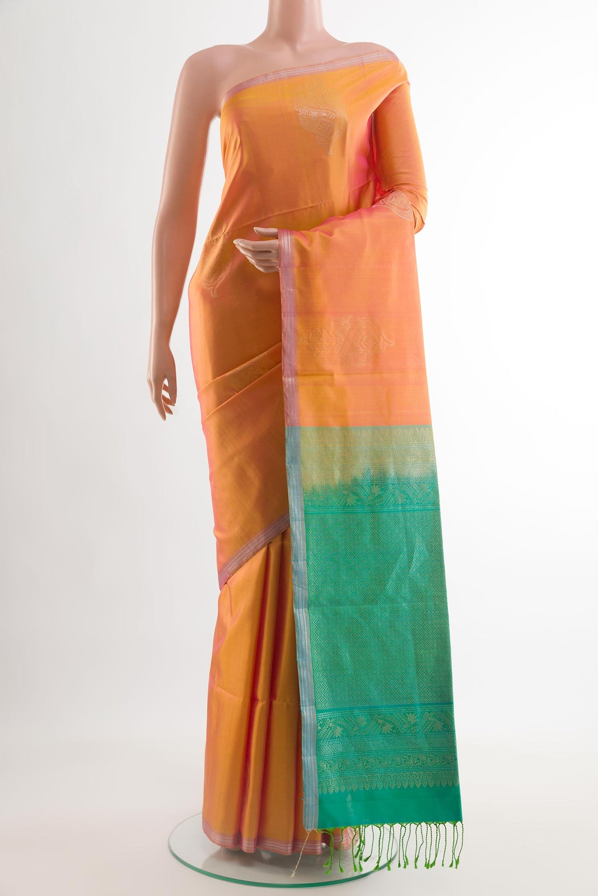 Pinkish Yellow Dual Tone Soft Silk Saree with Zari Butta on the body and Zari Border.  displayed on a mannequin