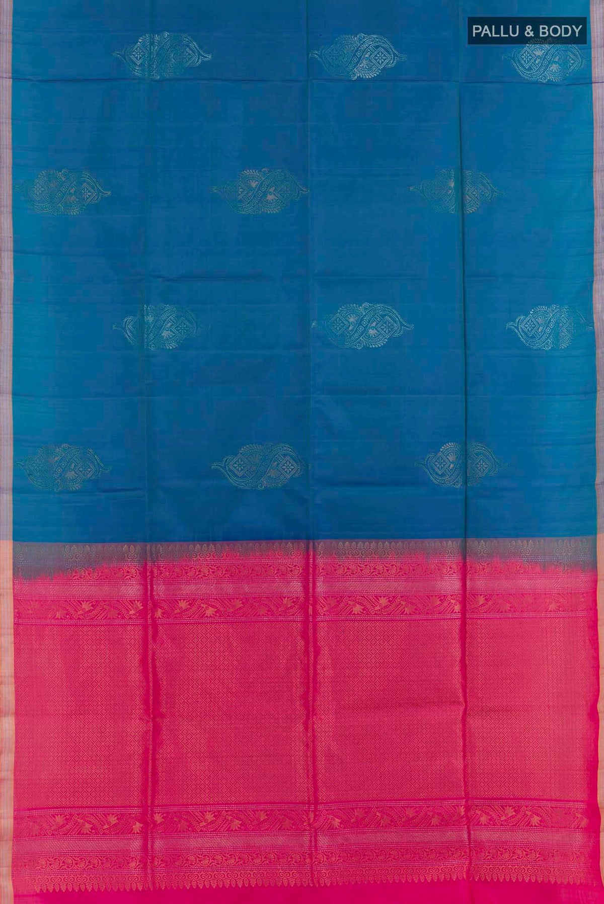 Flat view of Peacock Blue Soft Silk Saree with Zari Butta on the body and Zari Border. 