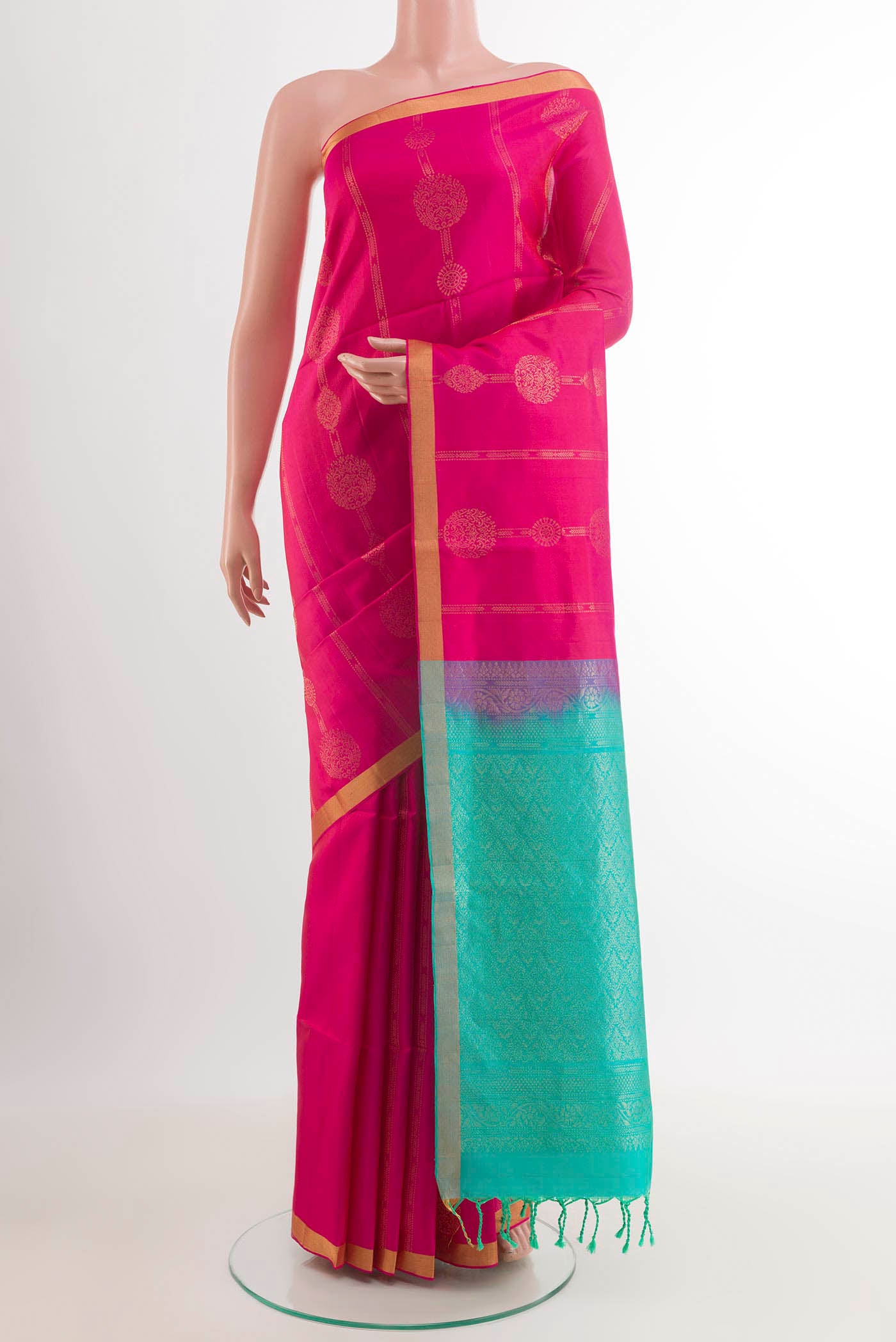 Pink Soft Silk Saree with Zari Butta on the body and Zari Border.  displayed on a mannequin
