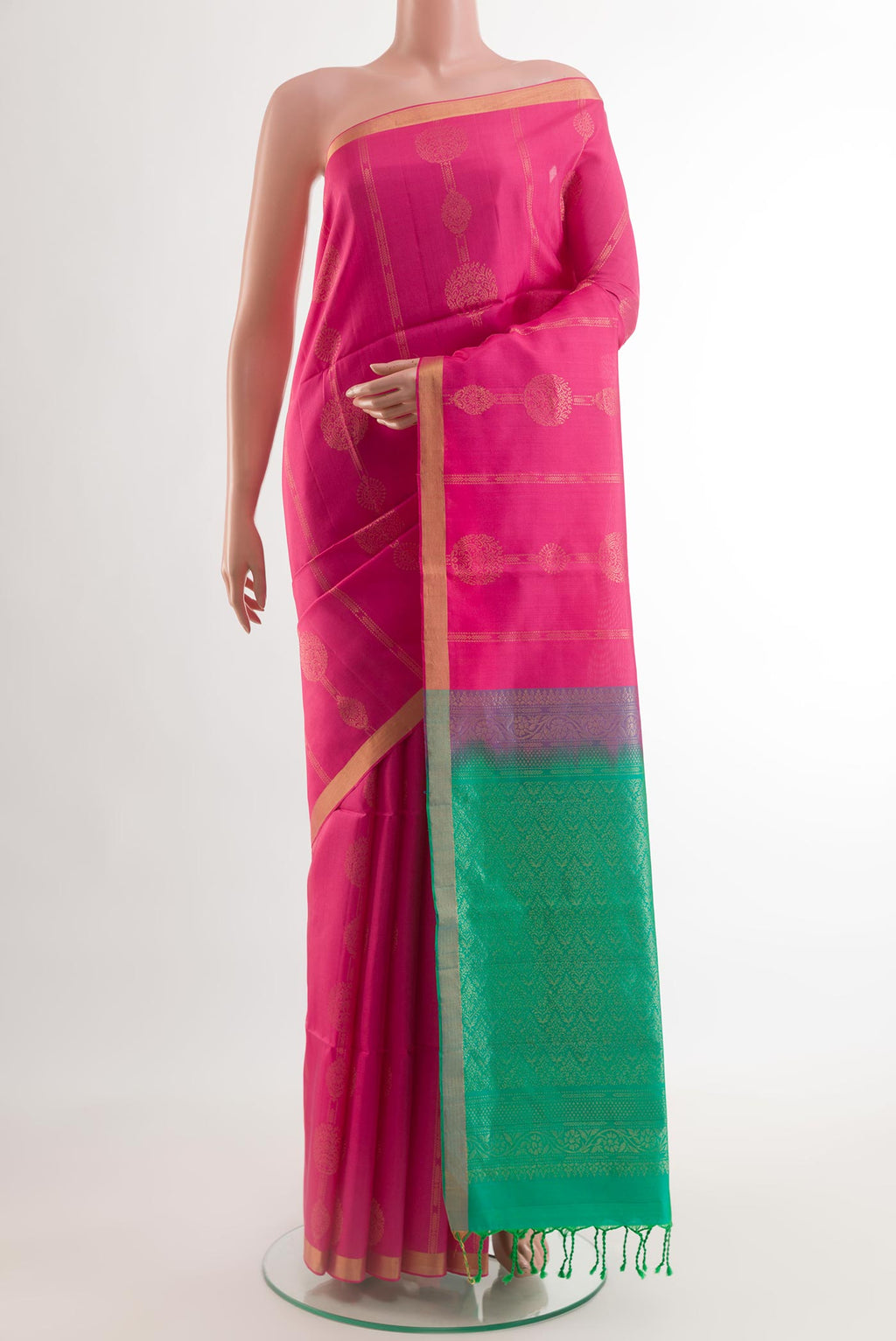 Sea Green Soft Silk Saree with Zari Butta on the body and Zari Border.  displayed on a mannequin