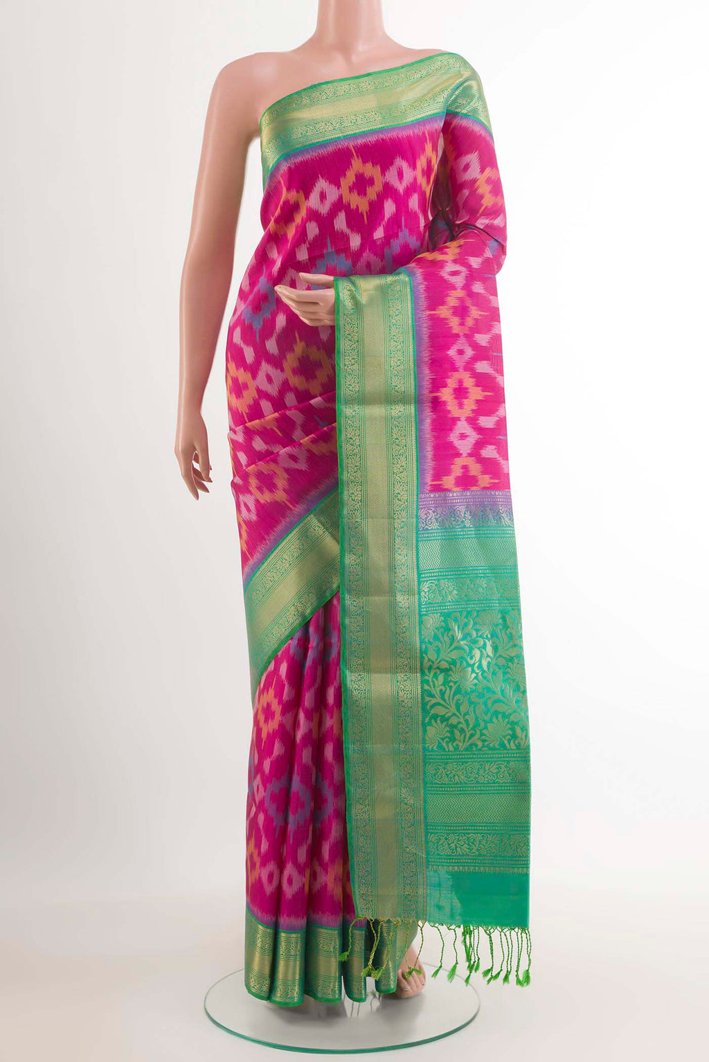 Pink Soft Silk Saree with Ikat design on the body and Zari Border.  displayed on a mannequin