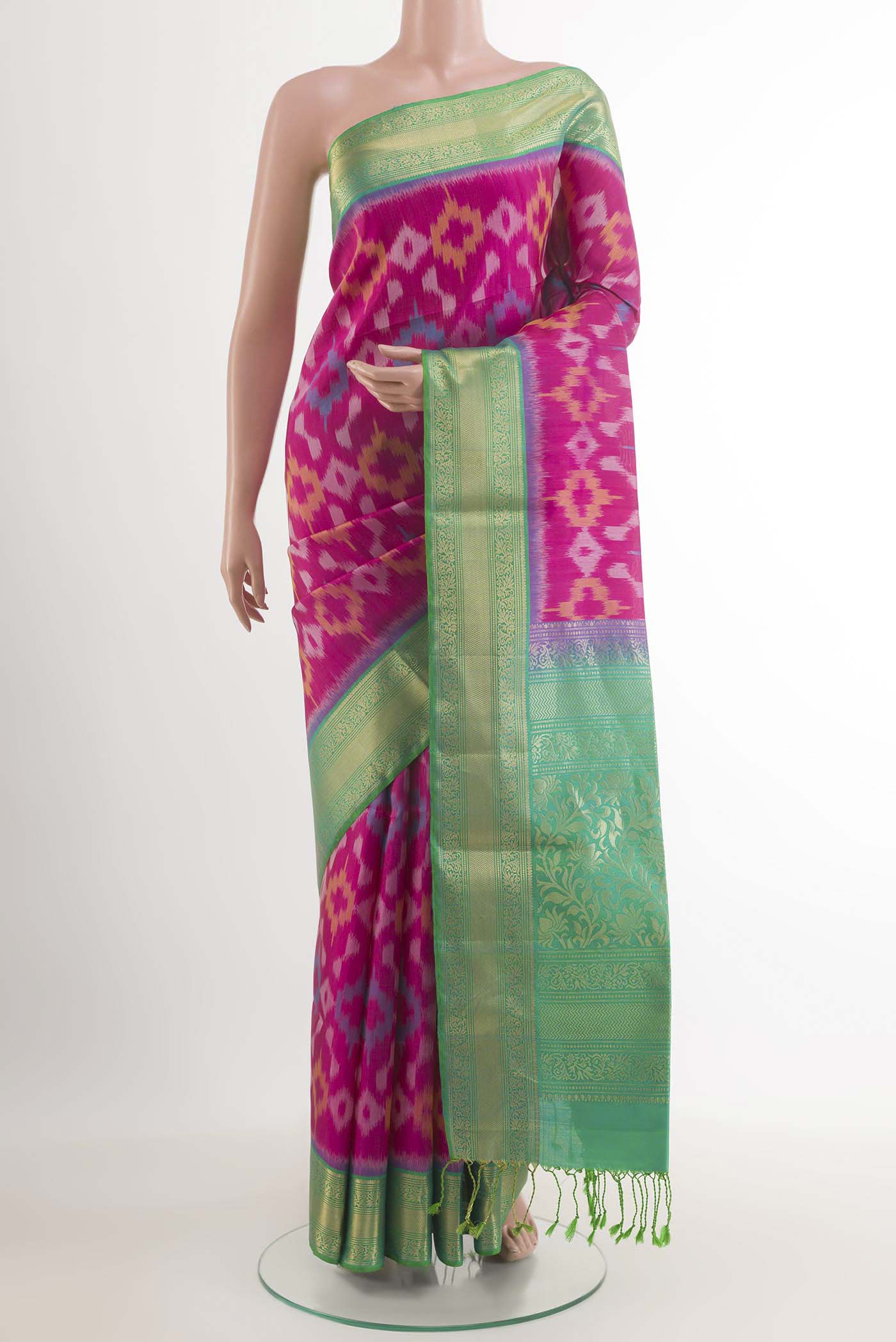Pink Soft Silk Saree with Ikat design on the body and Zari Border.  displayed on a mannequin