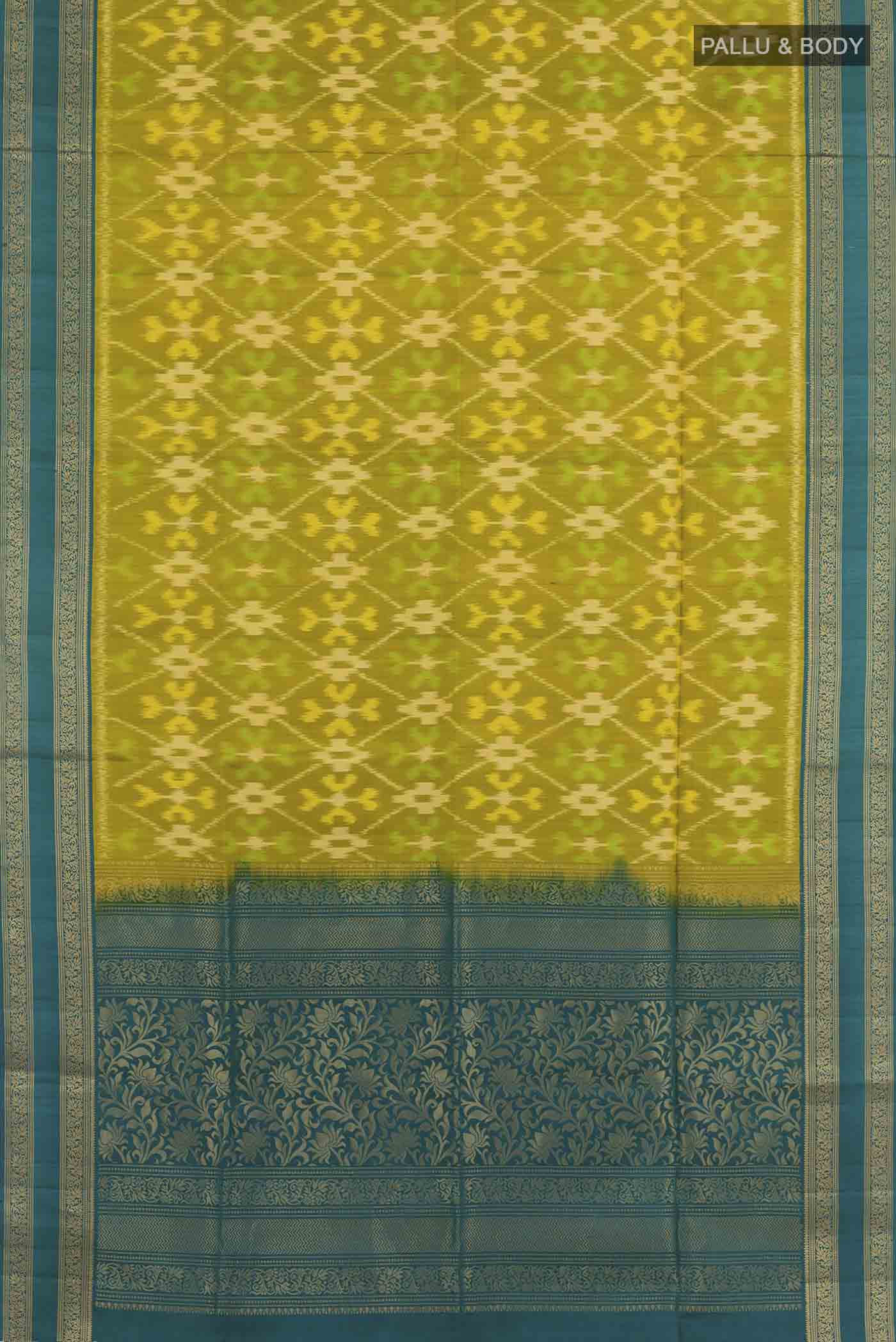 Flat view of Mehandi Green Soft Silk Saree with Ikat design on the body and Zari Border. 