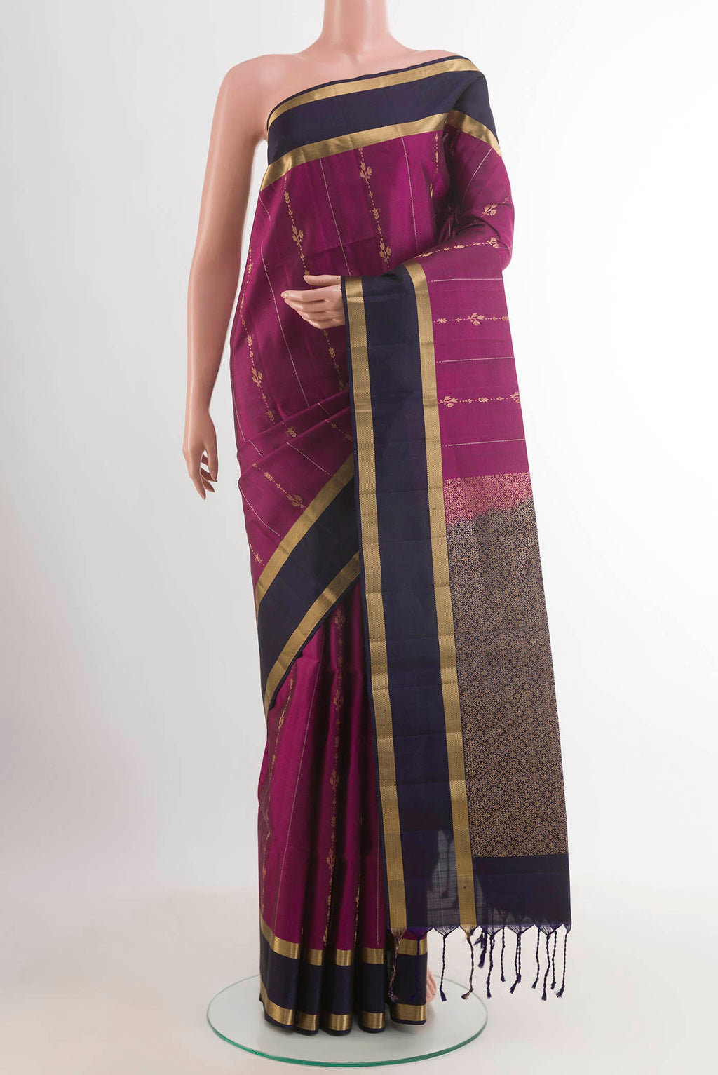 Purple Soft Silk Saree with Stripes on the body and Zari Border.  displayed on a mannequin