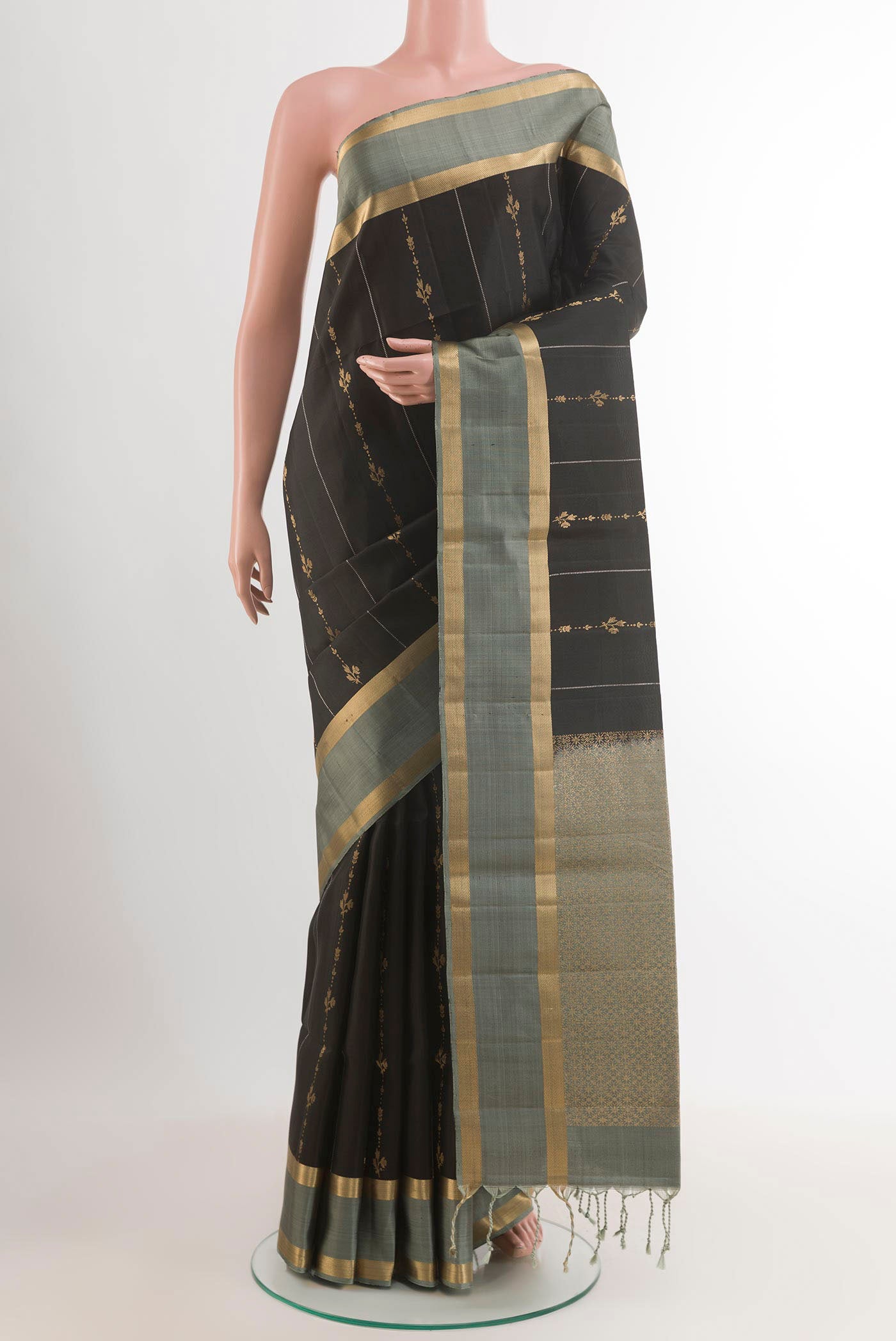 Black Soft Silk Saree with Stripes on the body and Zari Border.  displayed on a mannequin