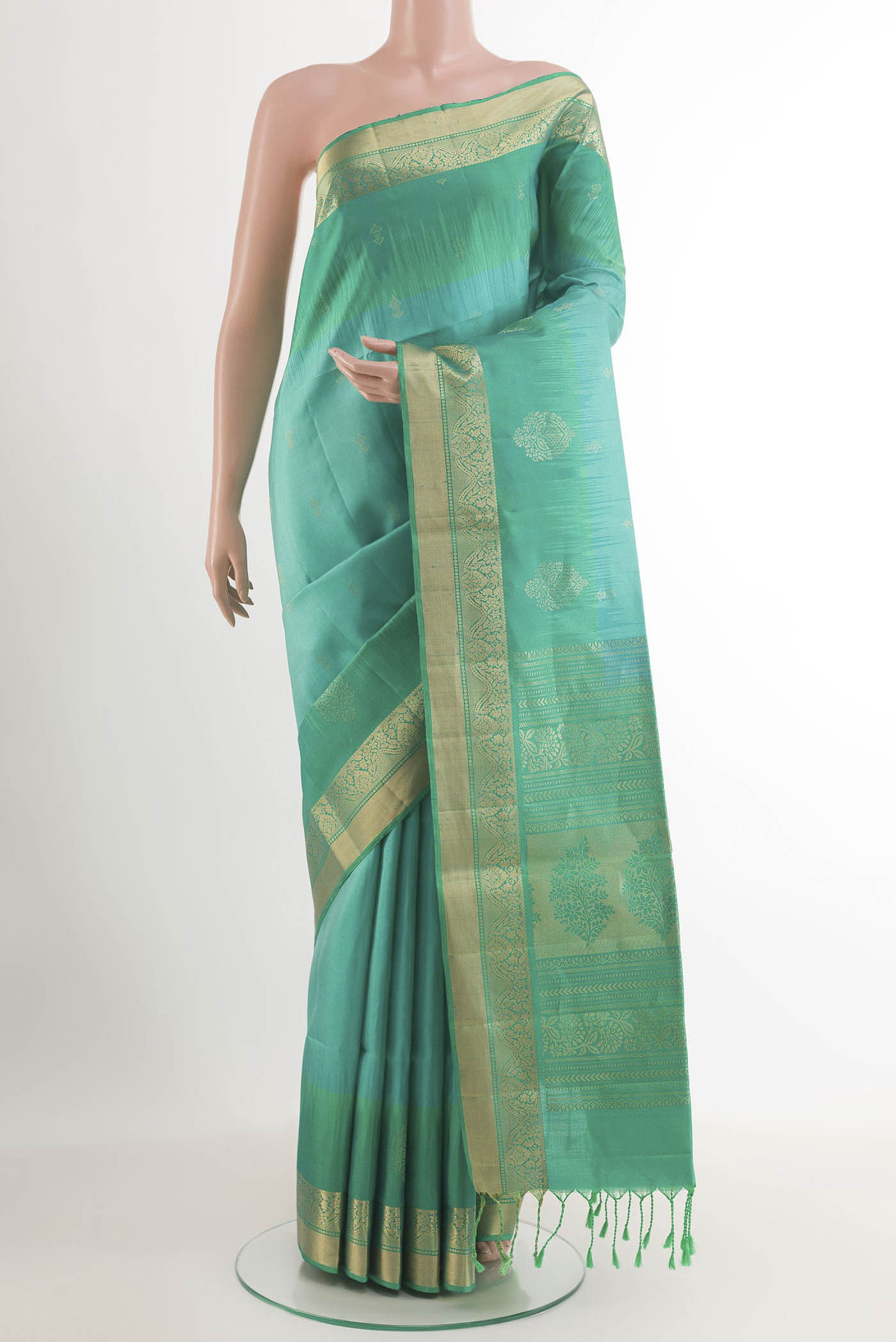 Sky Blue Soft Silk Saree with Zari Butta on the body and Zari Border.  displayed on a mannequin