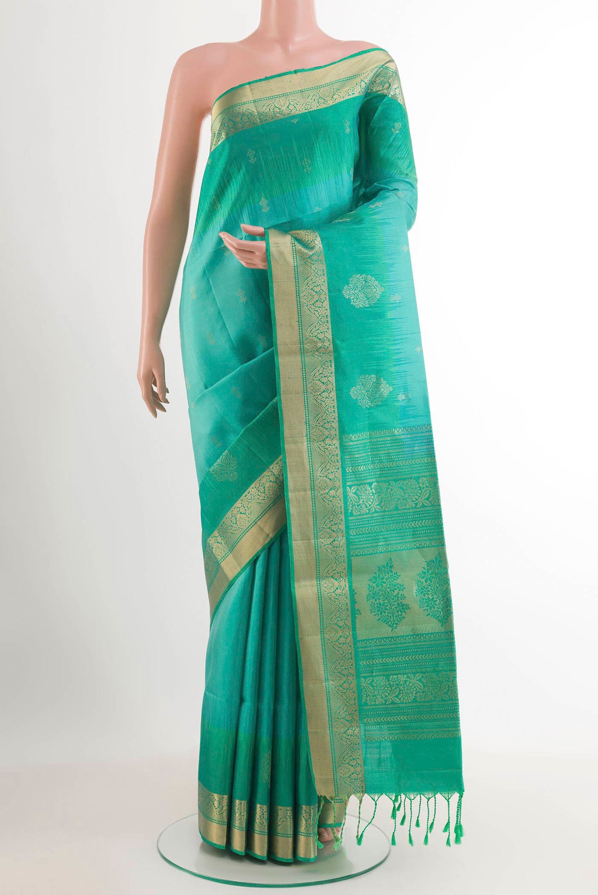 Sky Blue Soft Silk Saree with Zari Butta on the body and Zari Border.  displayed on a mannequin