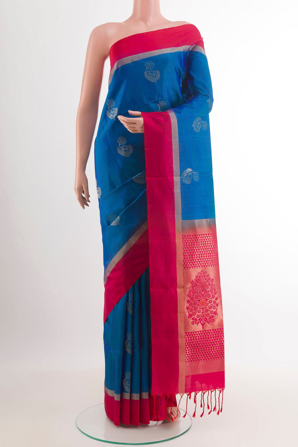 Blue Soft Silk Saree with Zari Butta on the body and Zari Border.  displayed on a mannequin