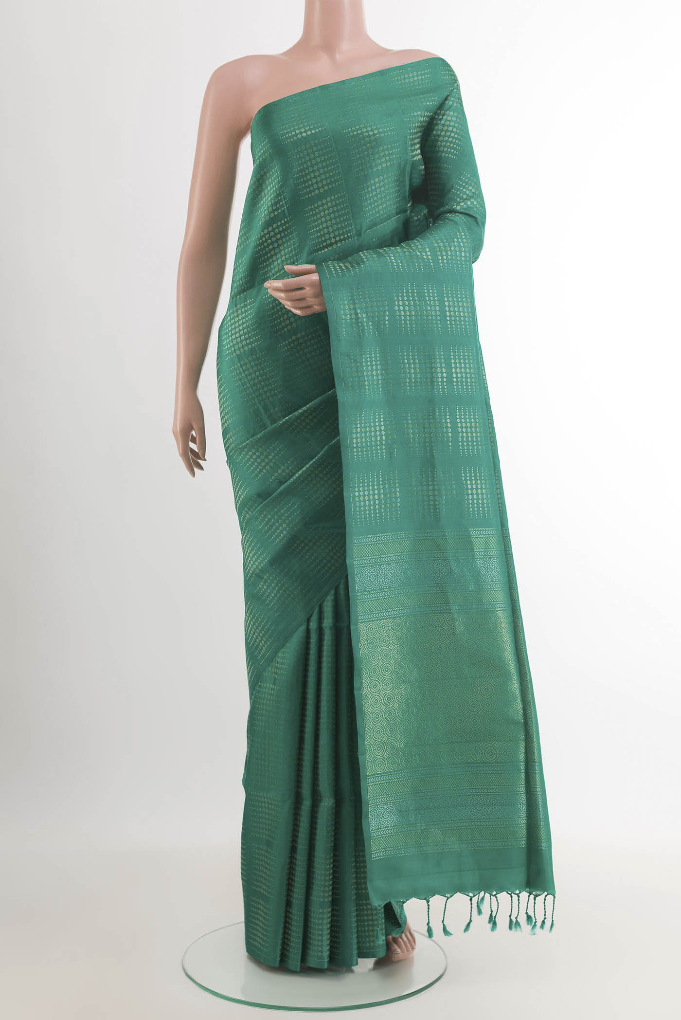 Sea Green Soft Silk Saree with Zari Butta on the body and Zari Border.  displayed on a mannequin
