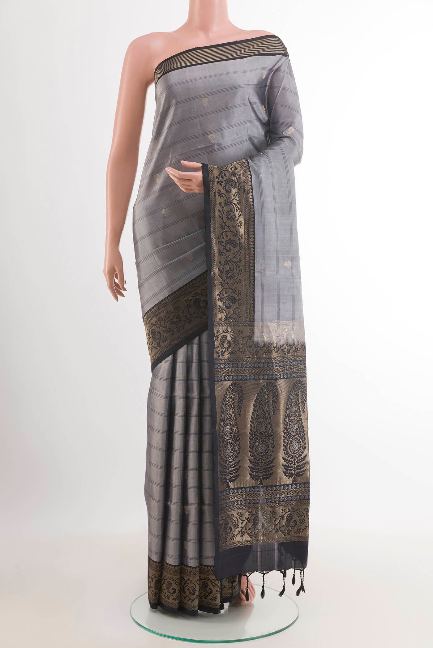 Grey Soft Silk Saree with Checked design on the body and Zari Border.  displayed on a mannequin