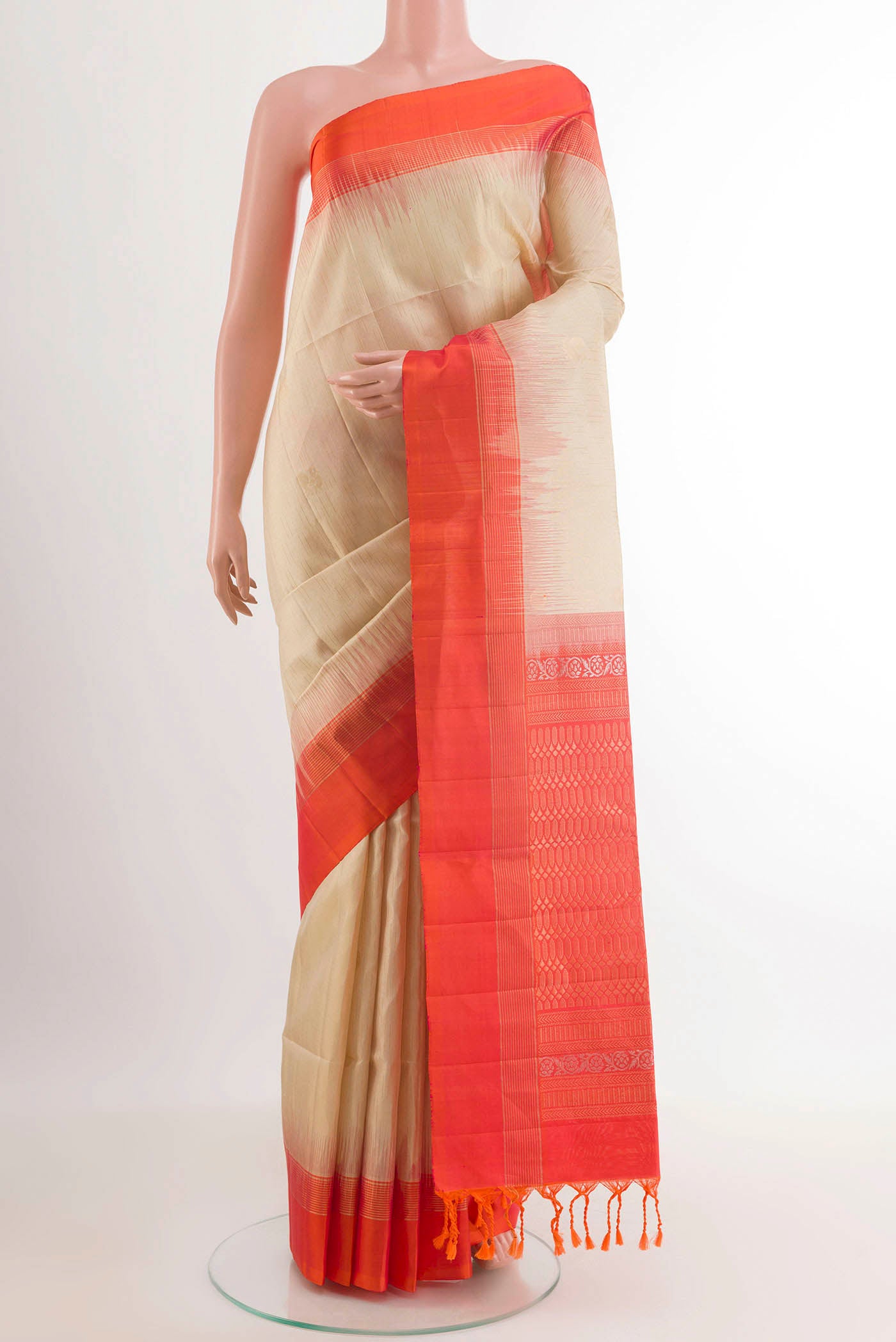 Cream Soft Silk Saree with Zari Butta on the body and Zari Border.  displayed on a mannequin