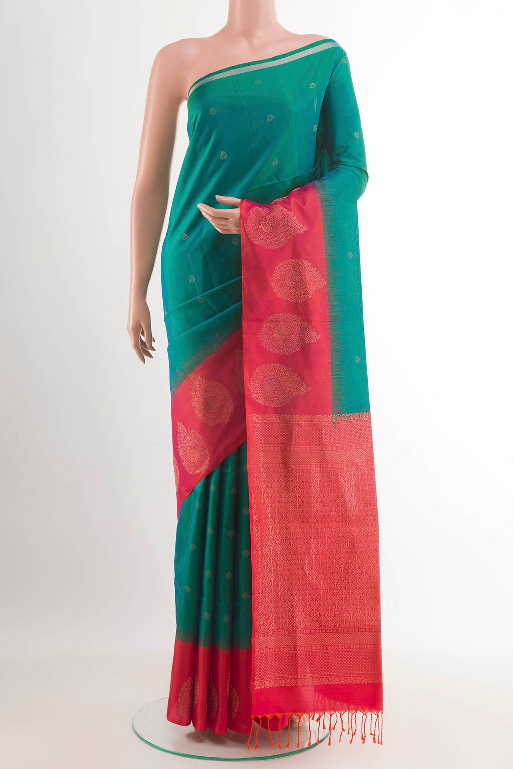 Sea Green Dual Tone Soft Silk Saree with Zari Butta on the body and Zari Border.  displayed on a mannequin