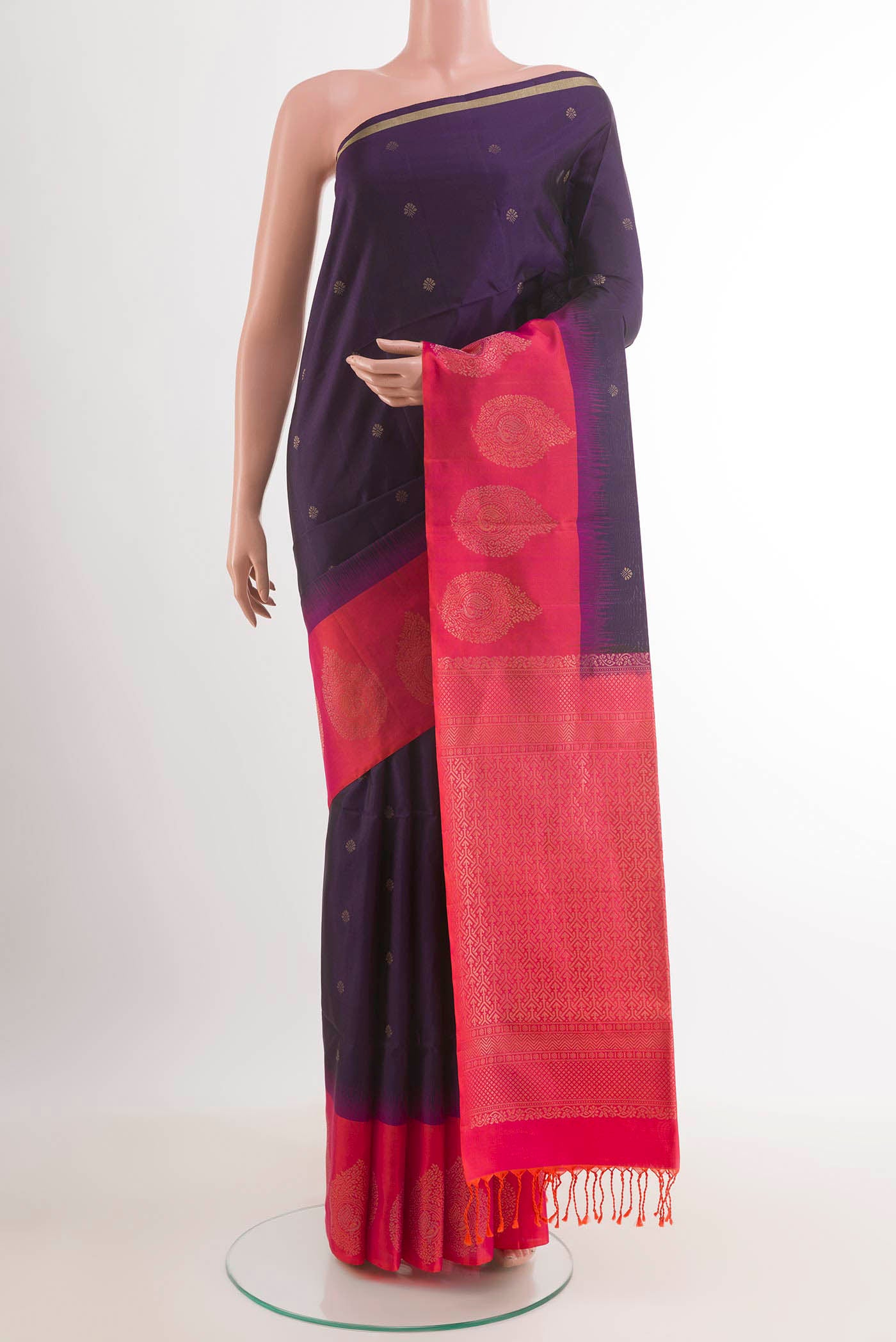 Dark Blue Soft Silk Saree with Zari Butta on the body and Zari Border.  displayed on a mannequin
