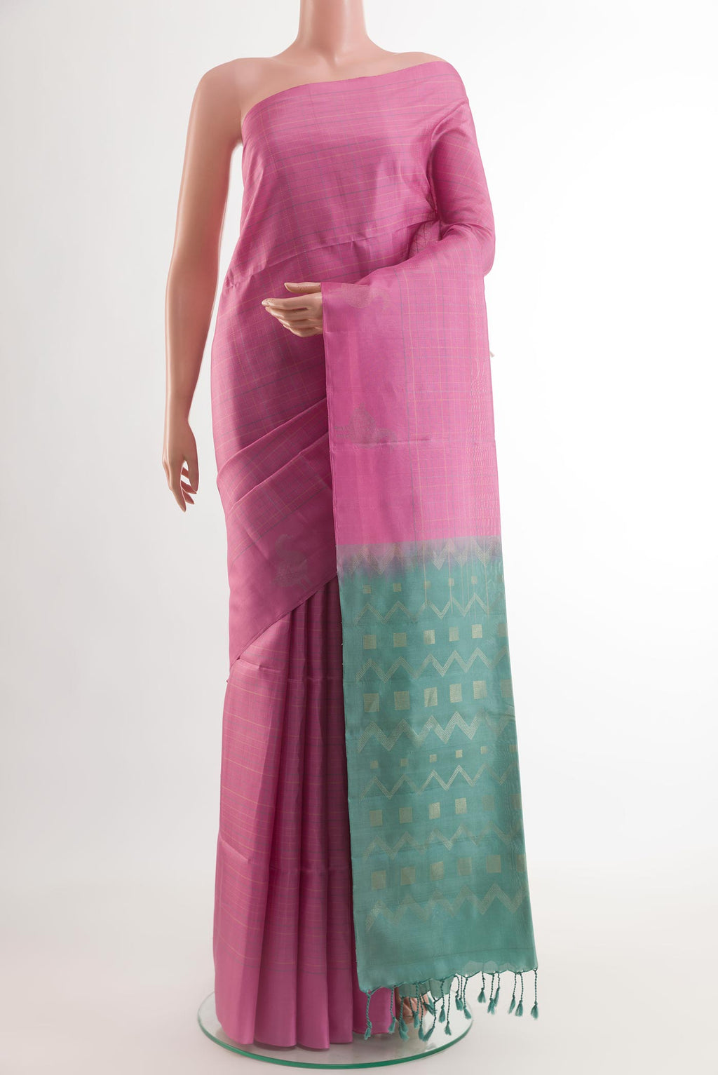 Pink Soft Silk Saree with Checked design on the body and Zari Border.  displayed on a mannequin