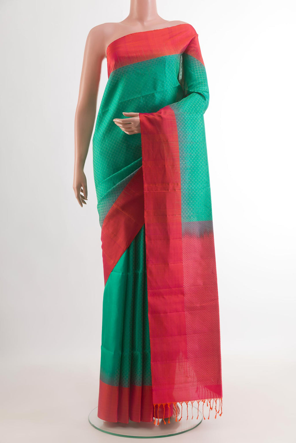 Sea Green Soft Silk Saree with Zari Butta on the body and Zari Border.  displayed on a mannequin
