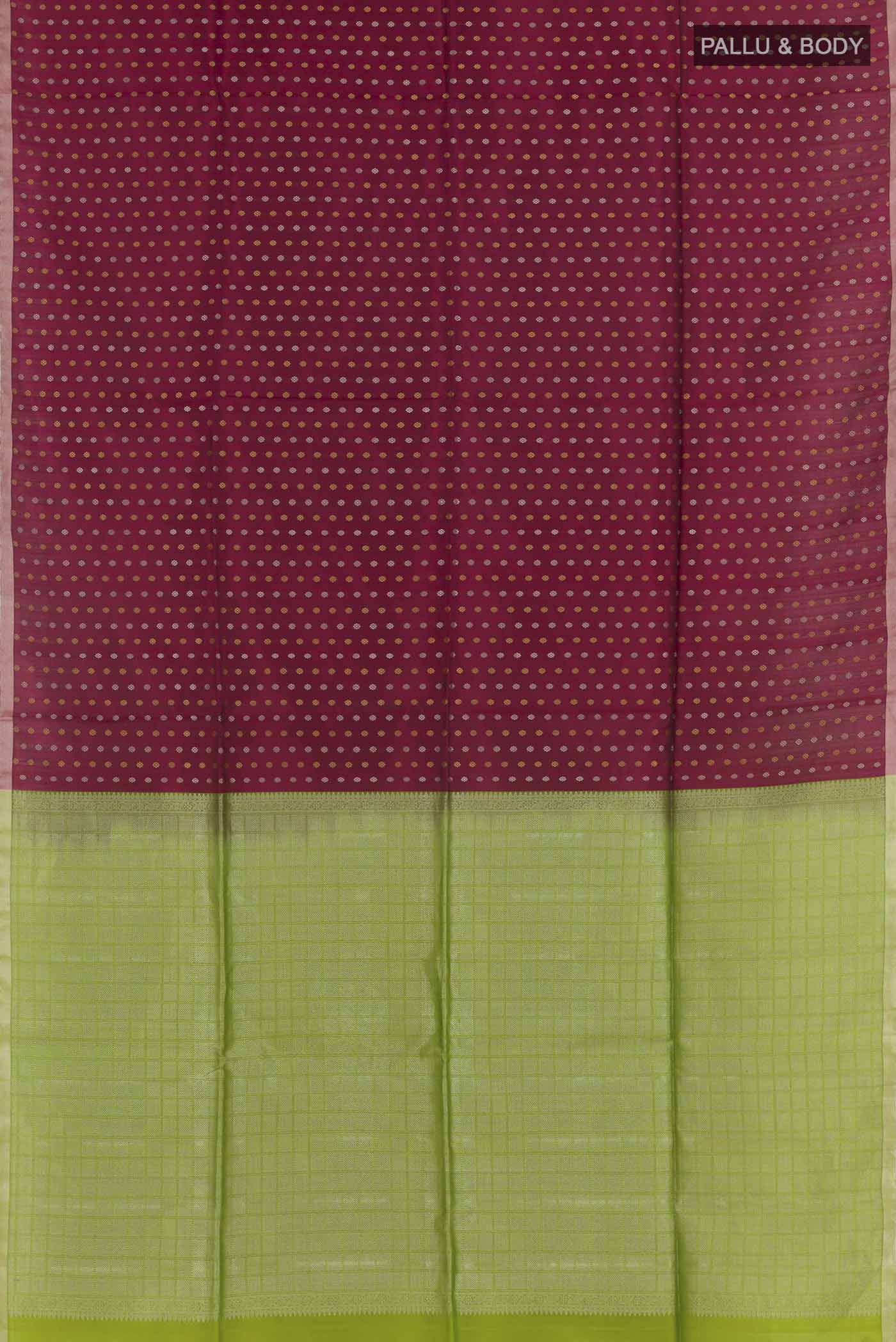 Flat view of Maroon Soft Silk Saree with Zari Butta on the body and Zari Border. 