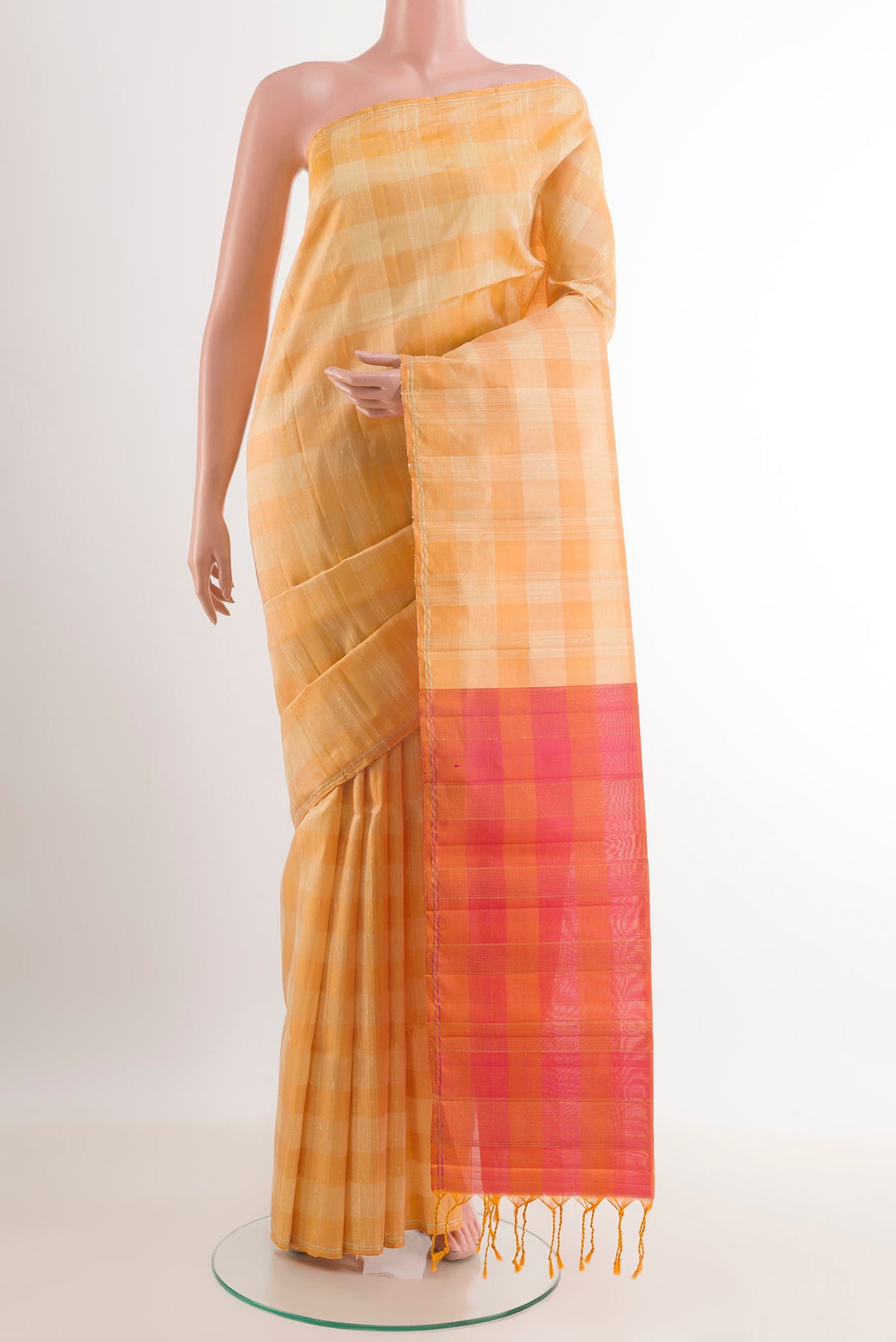 Yellow Soft Silk Saree with Checked design on the body and Zari Border.  displayed on a mannequin
