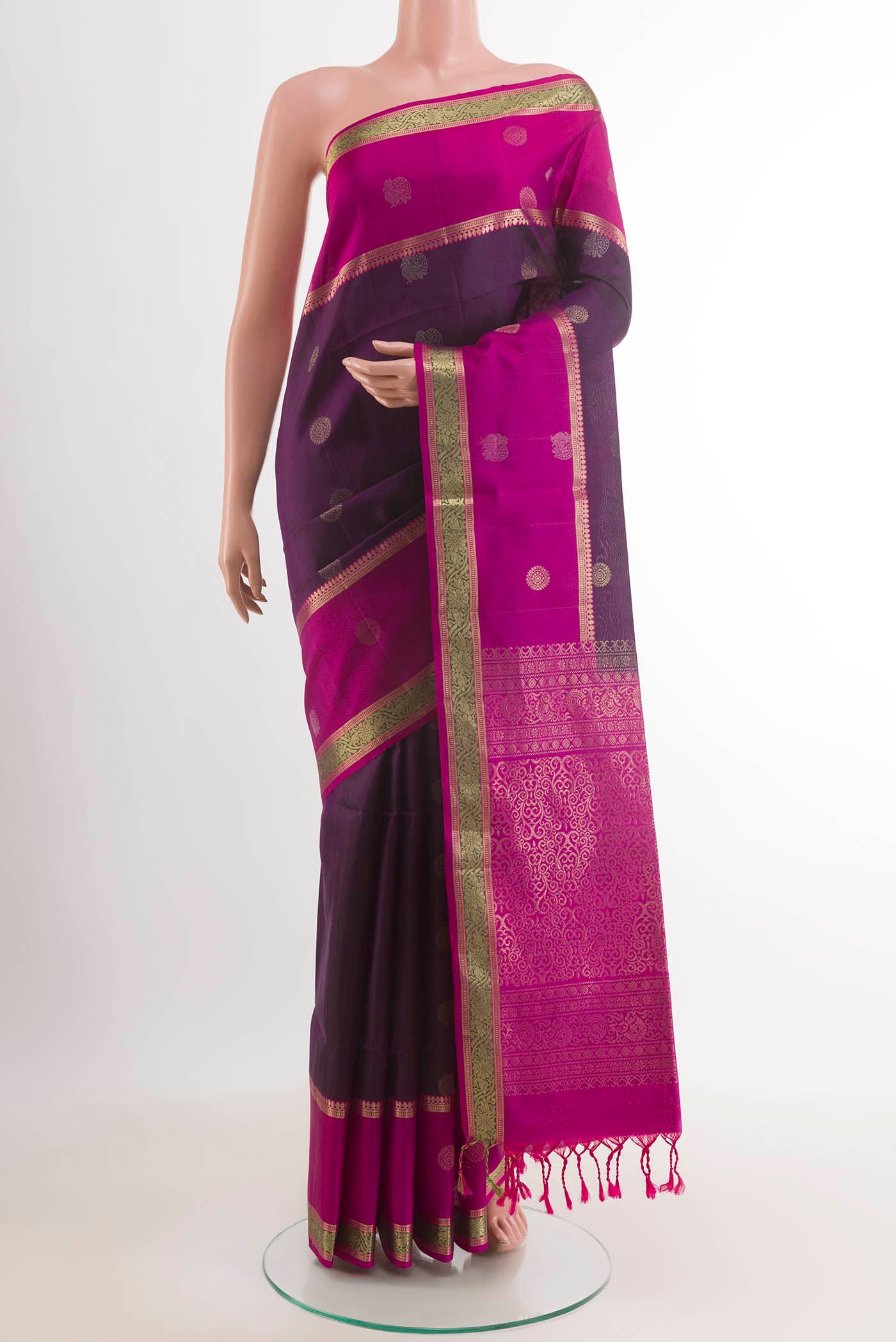 Purple Soft Silk Saree with Zari Butta on the body and Zari Border.  displayed on a mannequin