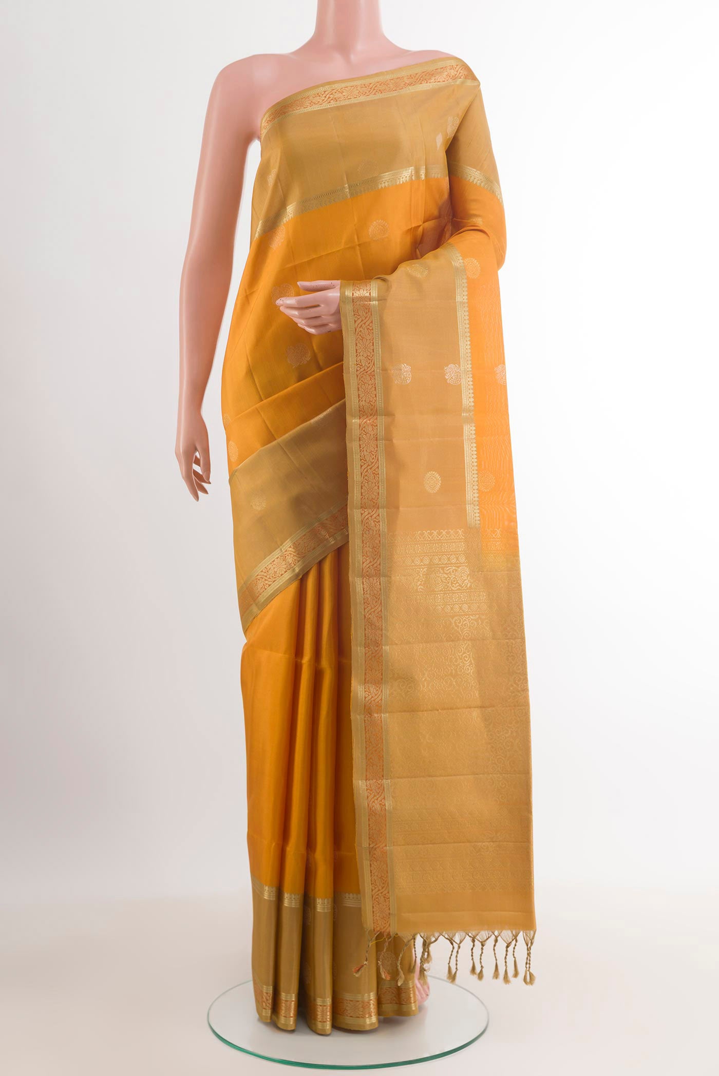 Mustard Dual Tone Soft Silk Saree with Zari Butta on the body and Zari Border.  displayed on a mannequin