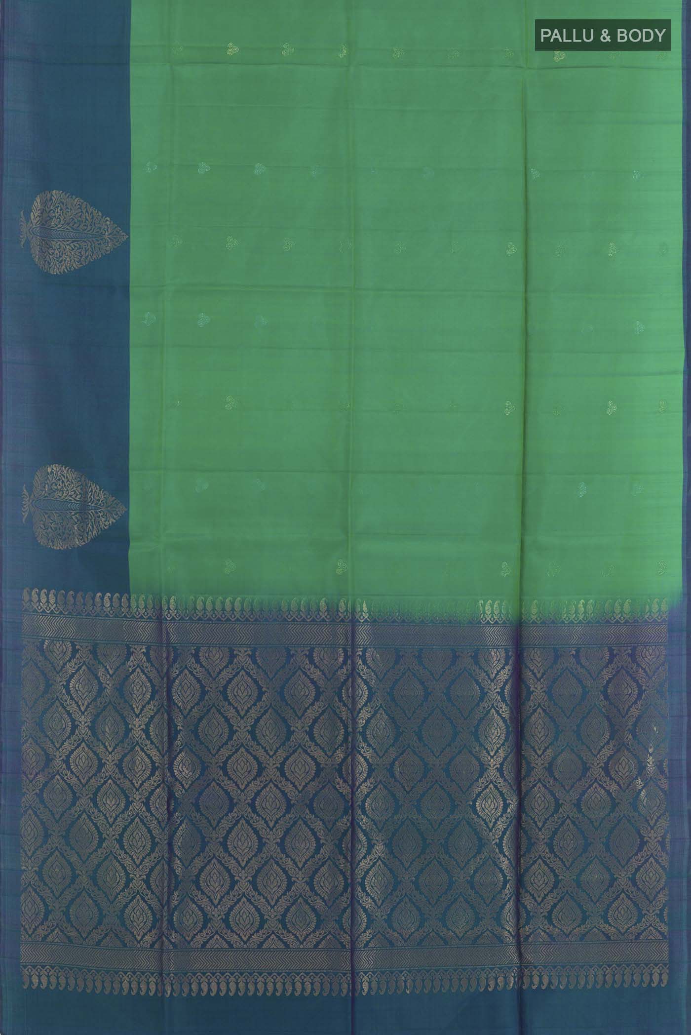 Flat view of Green Soft Silk Saree with Zari Butta on the body and Zari Border. 