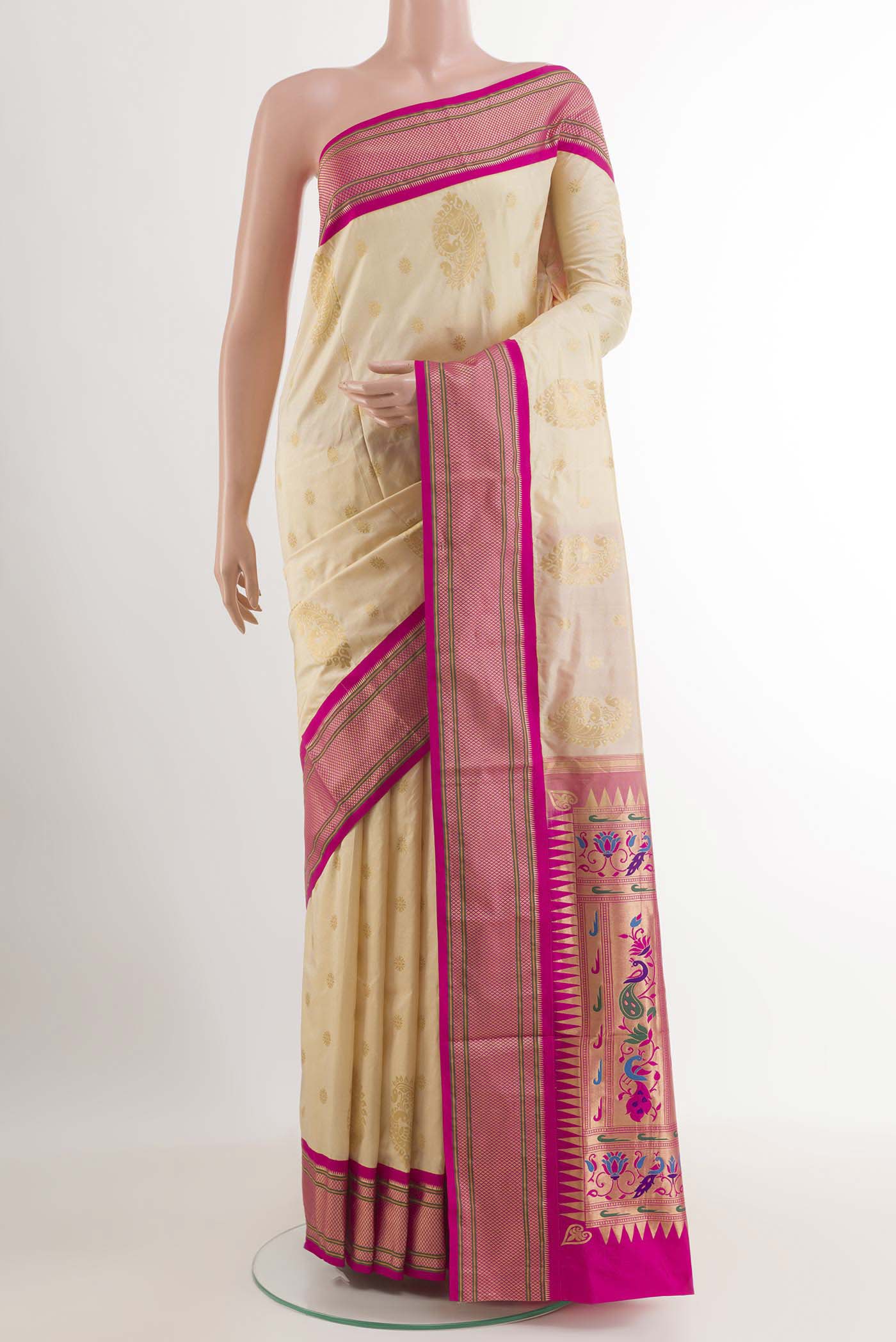 Off White Soft Silk Saree with Zari Butta on the body and Zari Border.  displayed on a mannequin