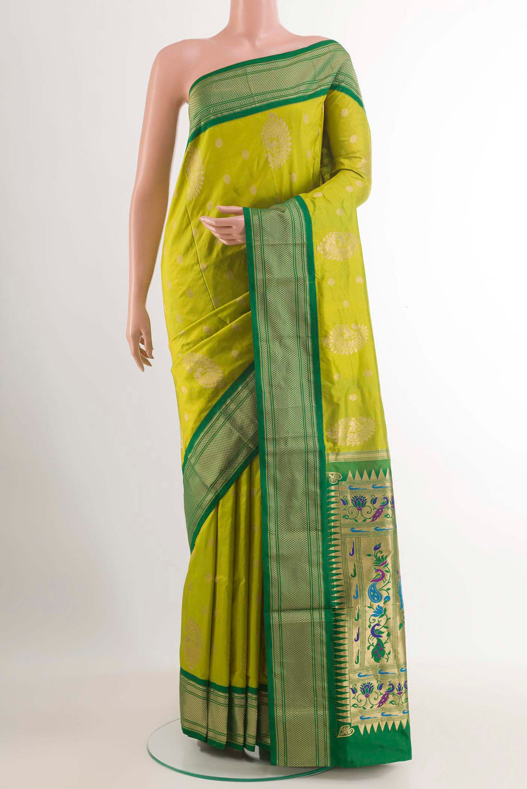 Green Soft Silk Saree with Zari Butta on the body and Zari Border.  displayed on a mannequin