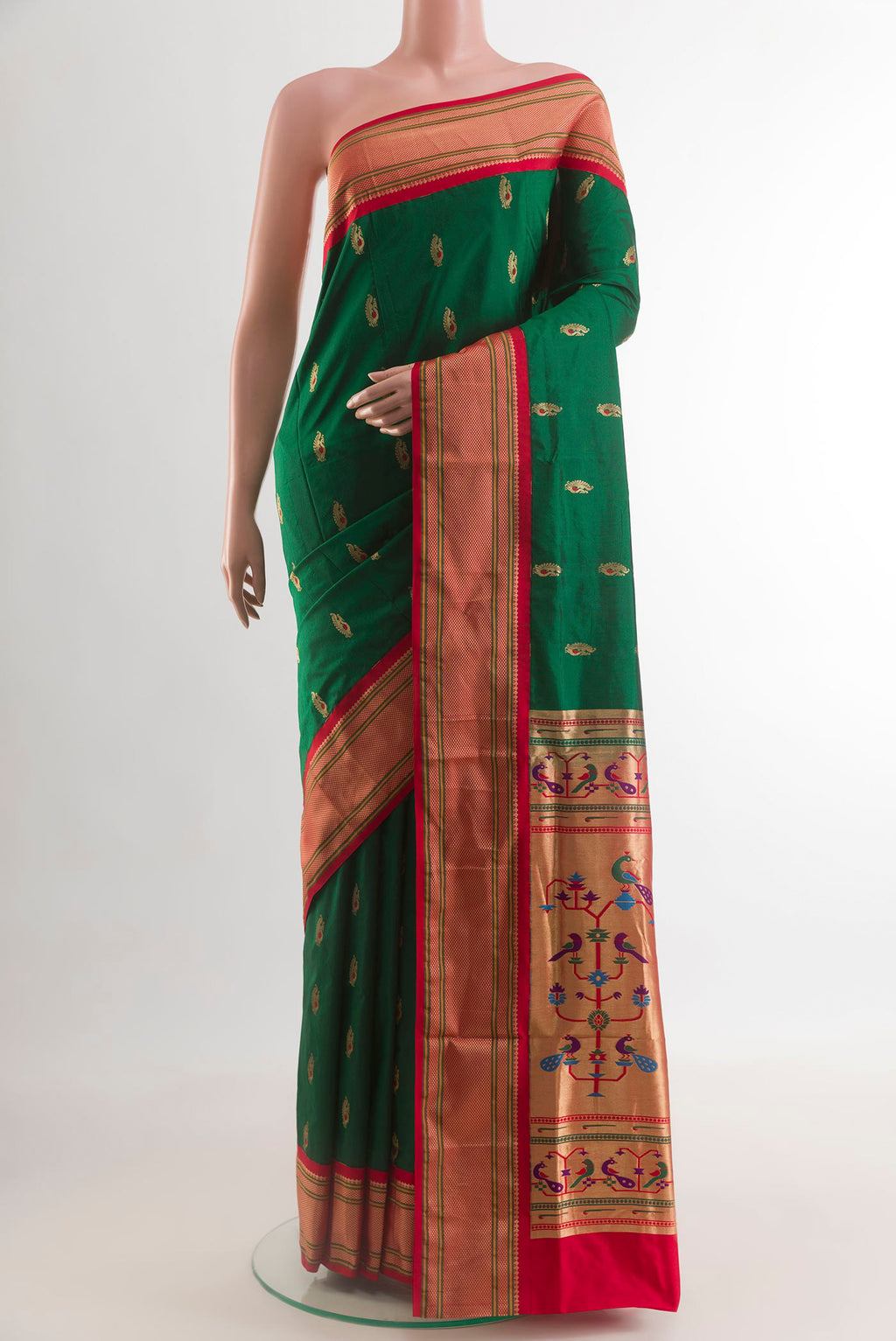Green Paithani Silk Saree with Zari Butta on the body and Zari Border.  displayed on a mannequin