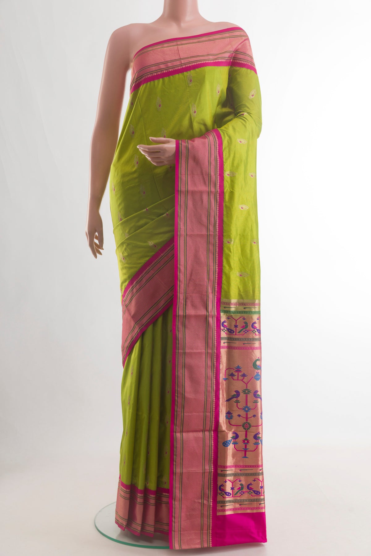 Green Paithani Silk Saree with Zari Butta on the body and Zari Border.  displayed on a mannequin