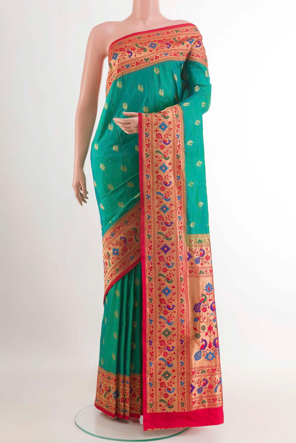 Green Paithani Silk Saree with Zari Butta on the body and Zari Border.  displayed on a mannequin