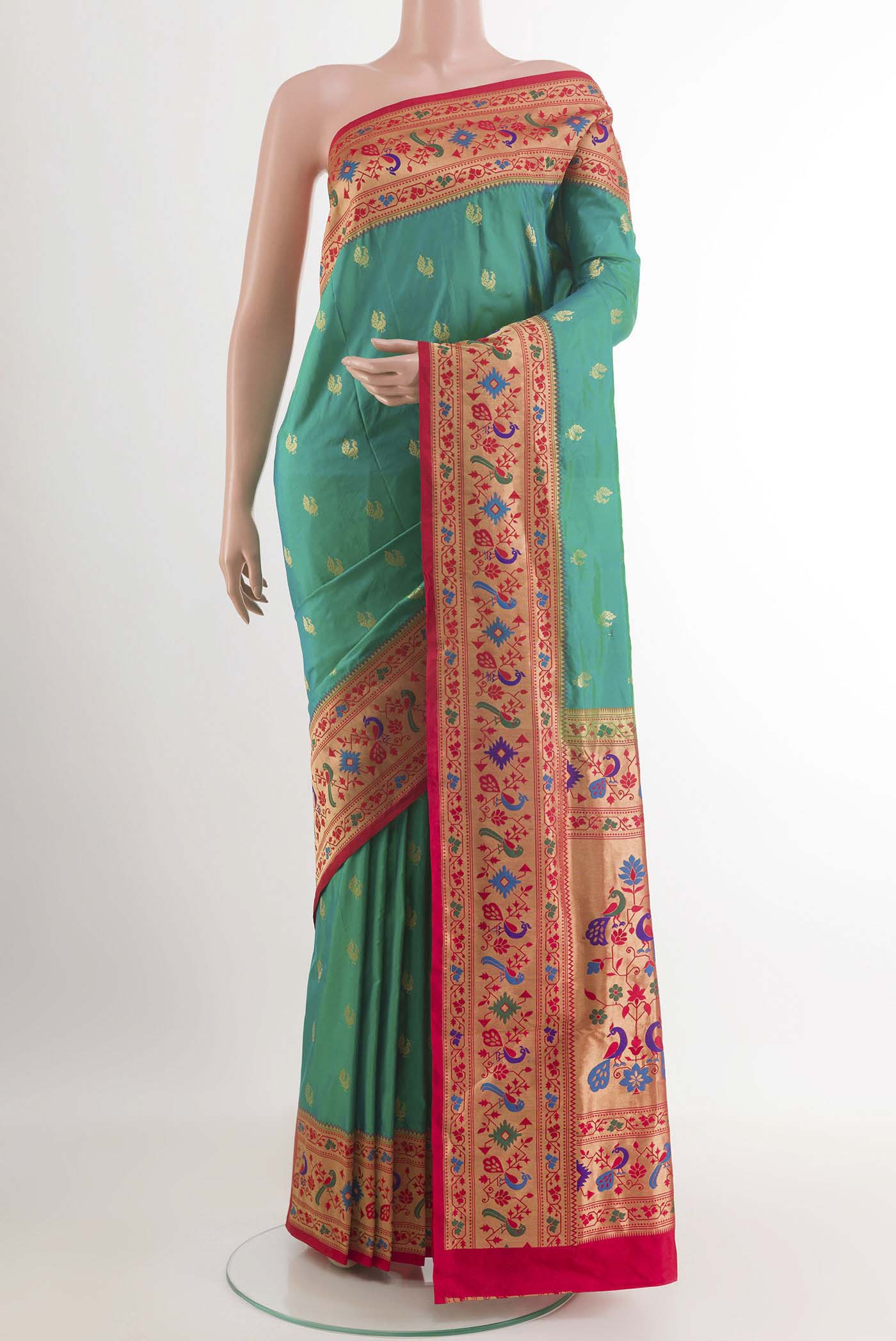 Green Paithani Silk Saree with Zari Butta on the body and Zari Border.  displayed on a mannequin