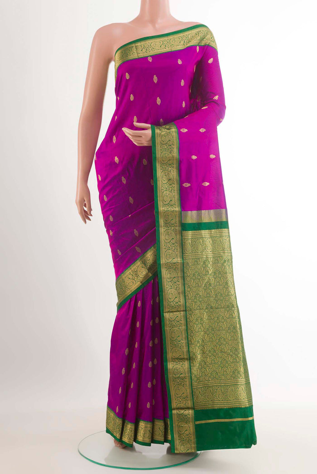 Purple Kanchipuram Silk Saree with Zari Butta on the body and Zari Border.  displayed on a mannequin